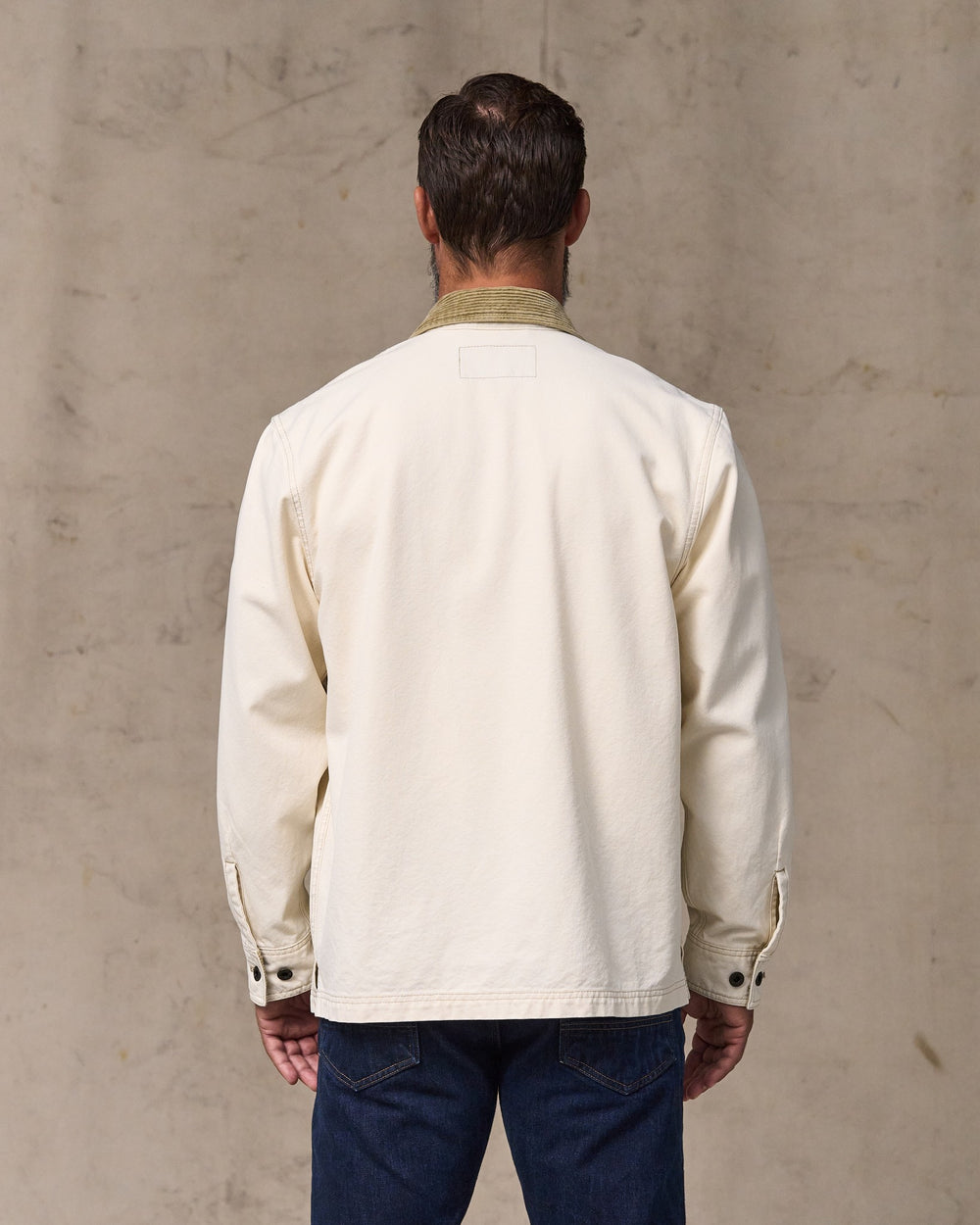 image of a model wearing Filson's Rustic Canvas Jac-shirt - Natural Seed
