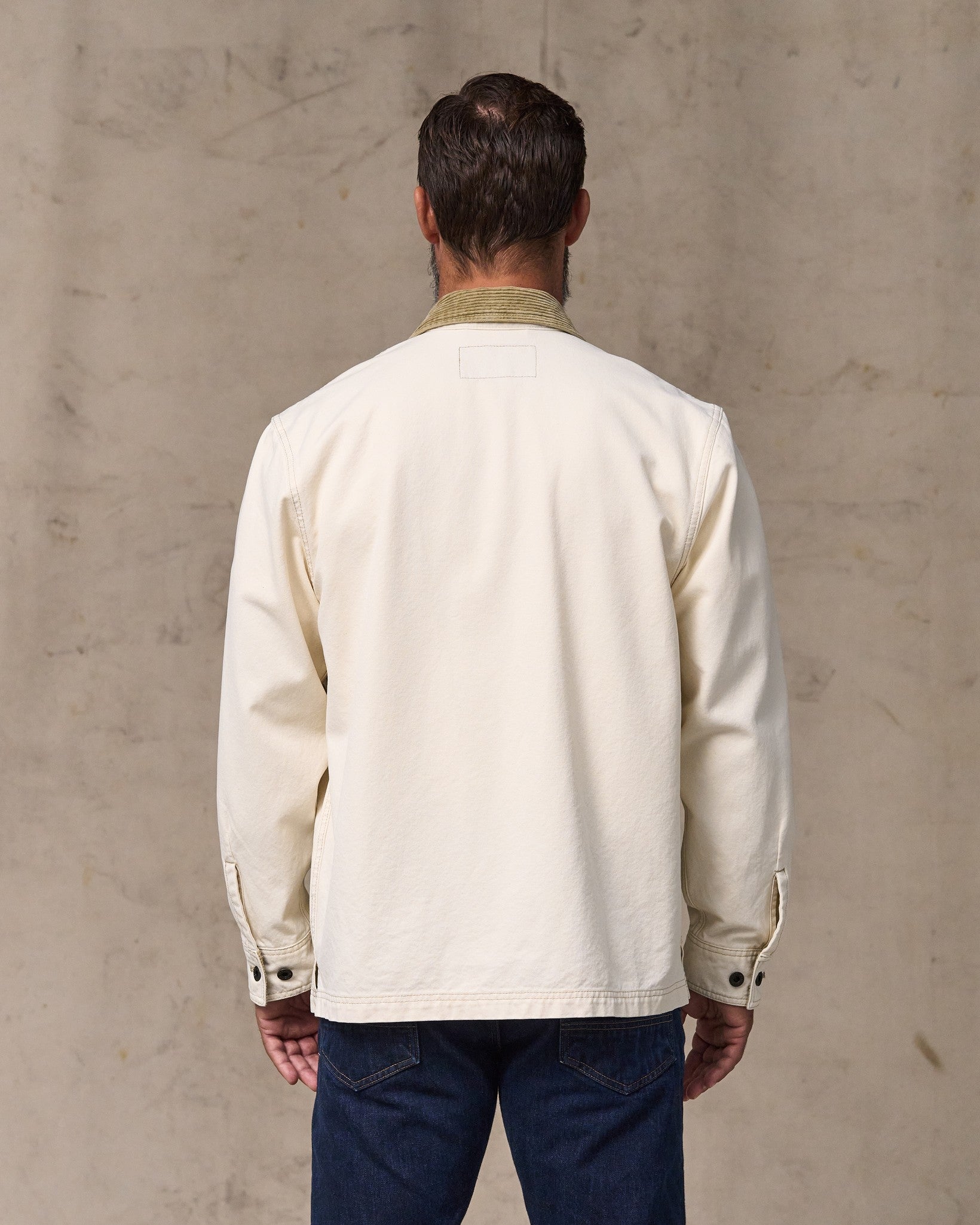image of a model wearing Filson's Rustic Canvas Jac-shirt - Natural Seed
