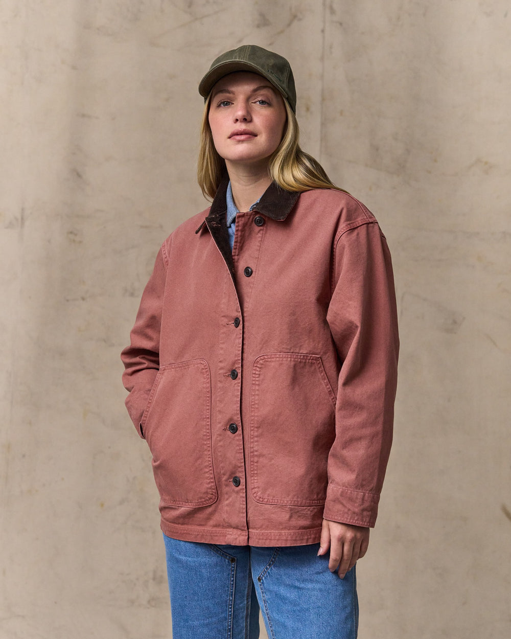 image of a model wearing Filson's Women's Canvas Barn Coat - Mahogany