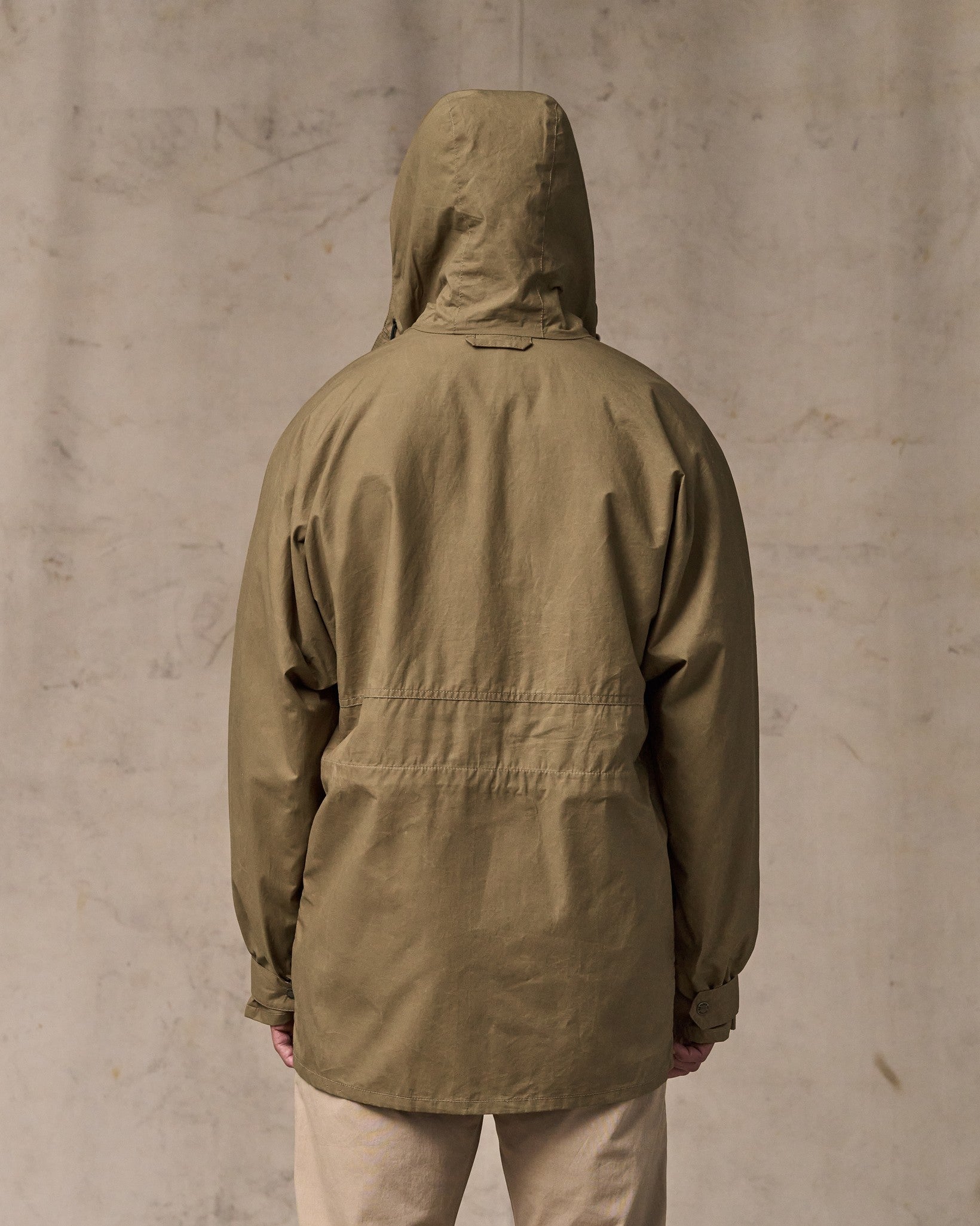 image of a model wearing Filson's Dry Wax Omak Coat - Dark Beige