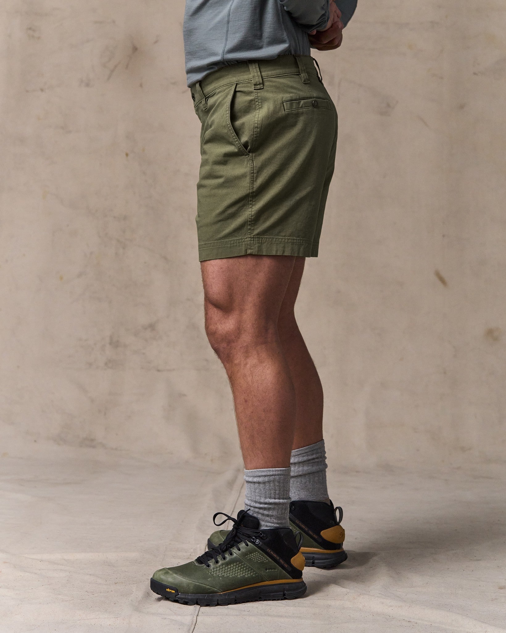 image of a model wearing Filson's Granite Mountain 6" Shorts - Burnt Olive