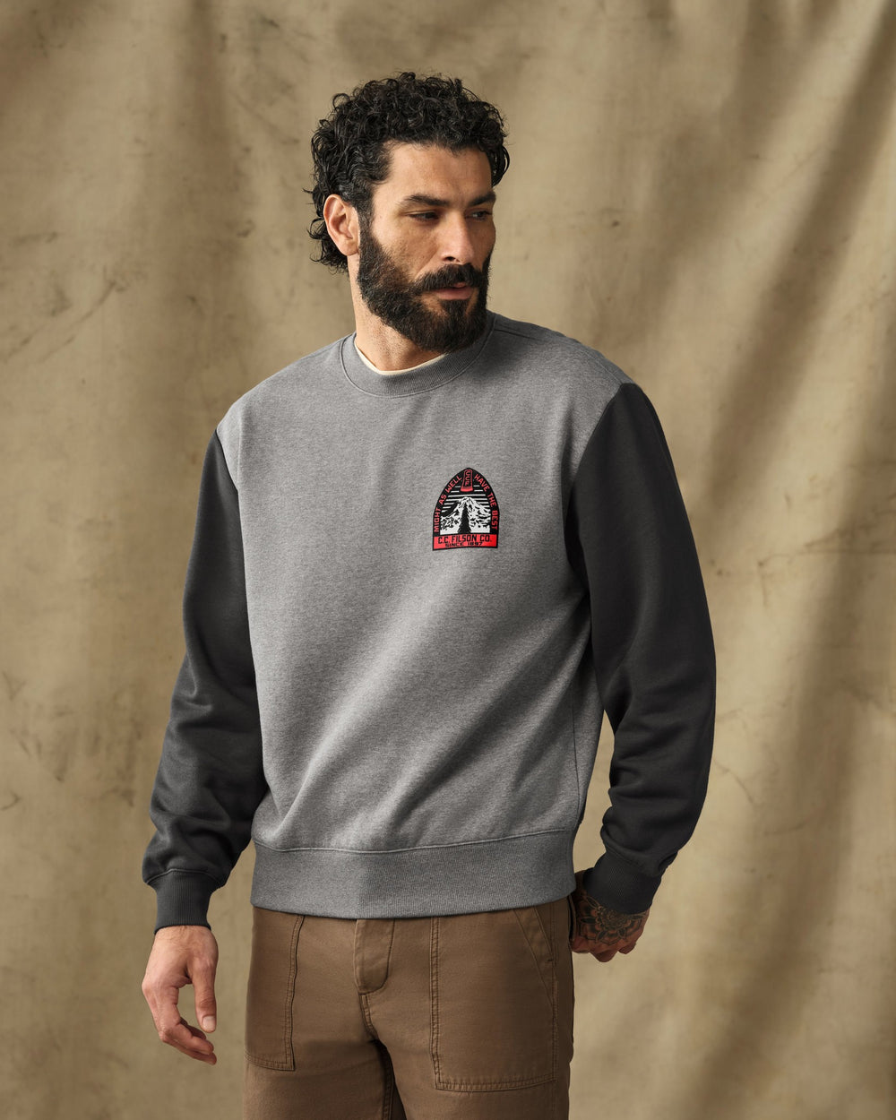 image of a model wearing Filson's Forestry Graphic Crewneck Sweatshirt - Vintage Heather Gray