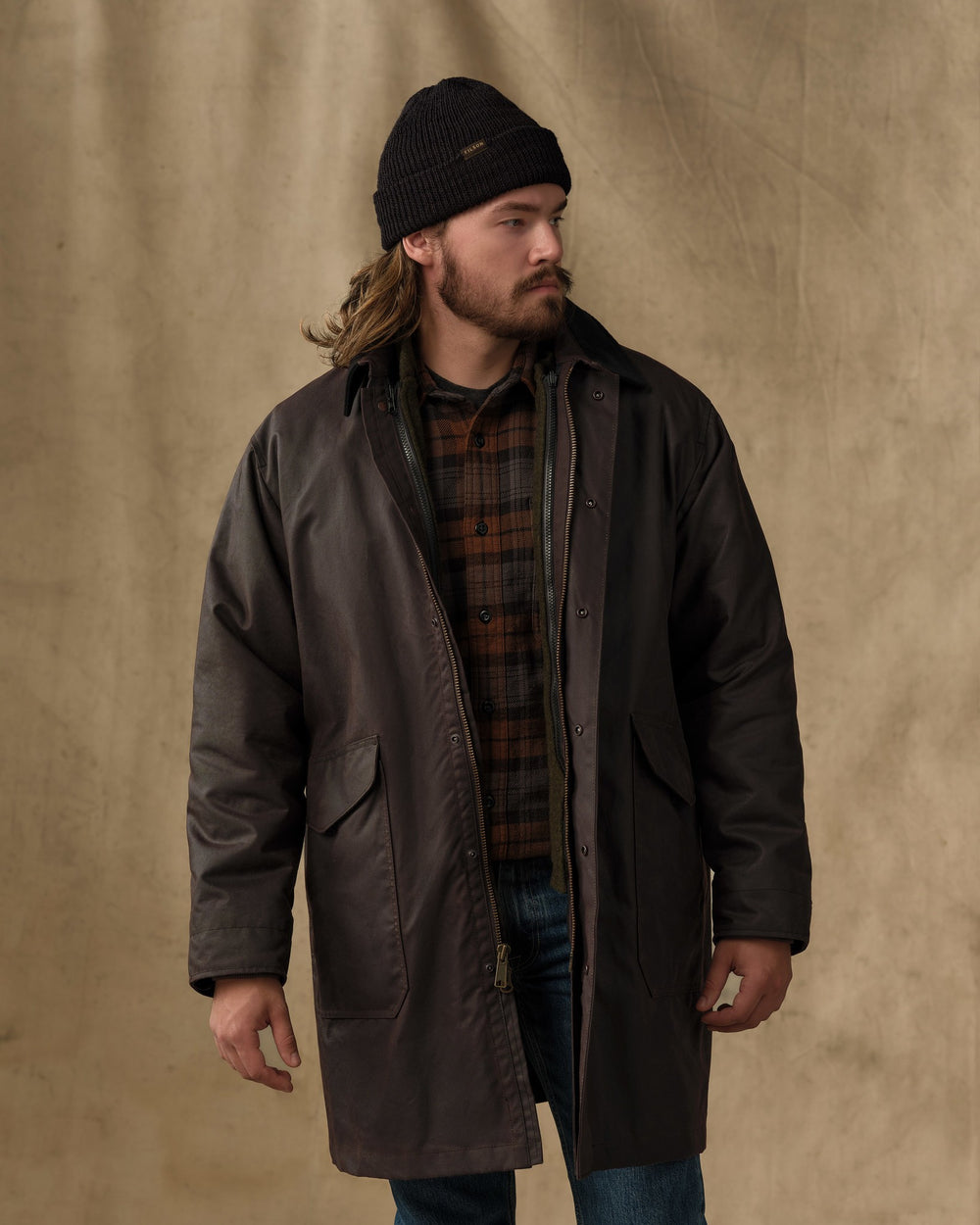 image of a model wearing Filson's Shelter Cloth Trench Coat - Orca Gray