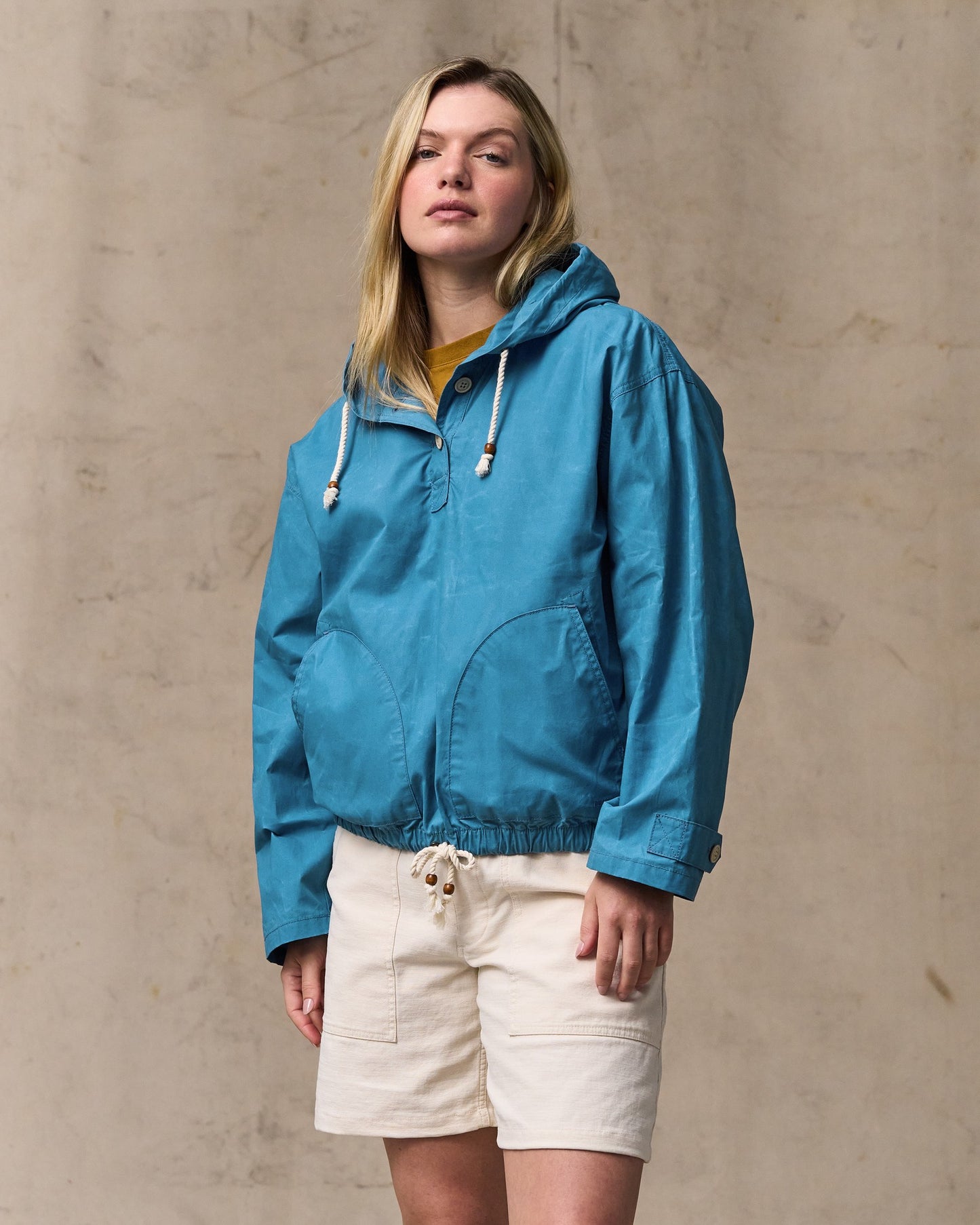 image of a model wearing Filson's Women's Dry Wax Hooded Popover - Marine Blue|Model is 5'10" wearing a size medium