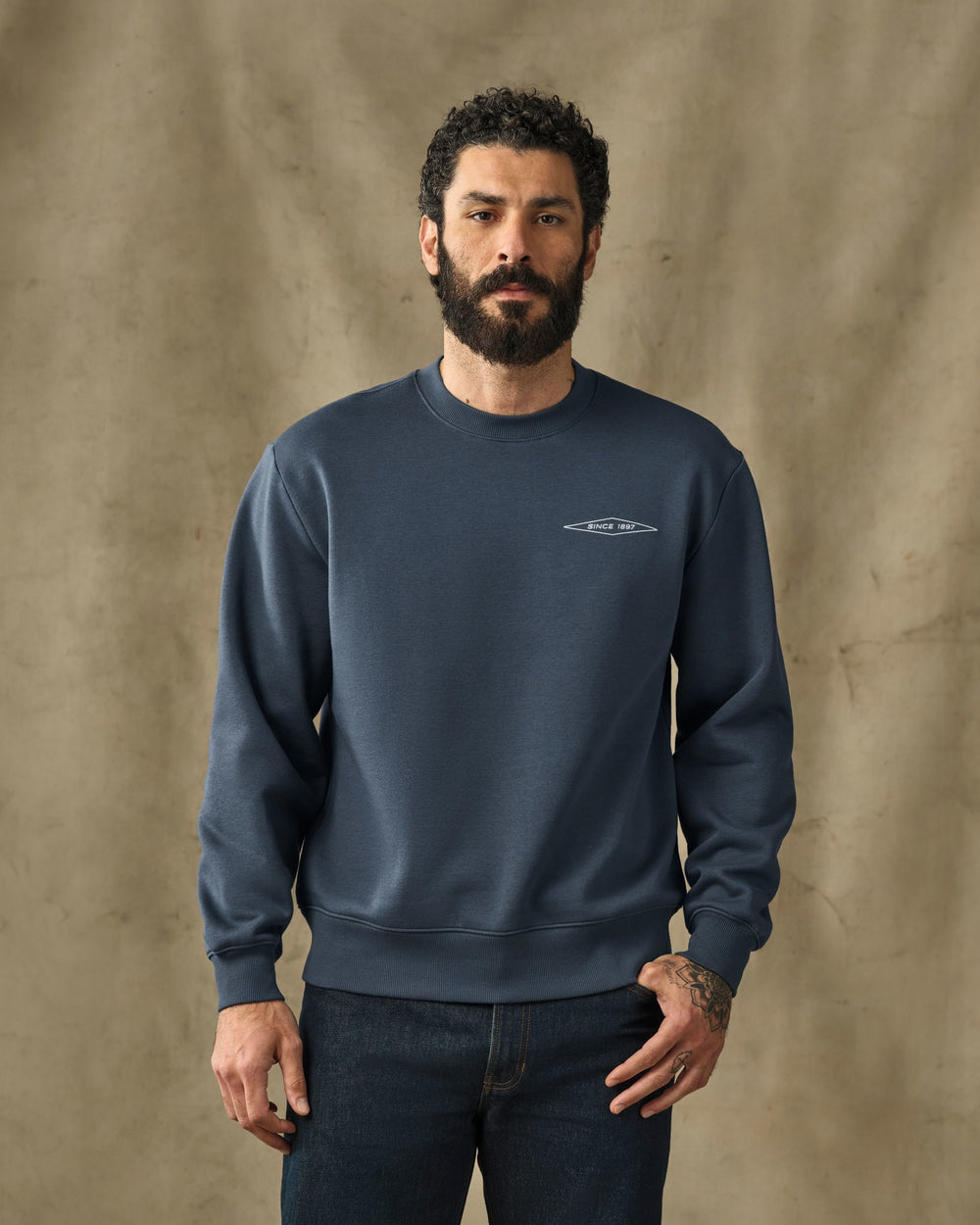 image of a model wearing Filson's Diamond Graphic Crewneck Sweatshirt - Ink Blue