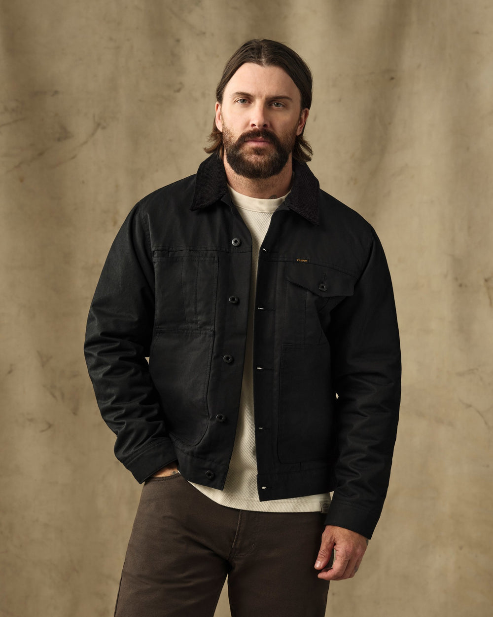image of a model wearing Filson's Insulated Short Cruiser Jacket - Black