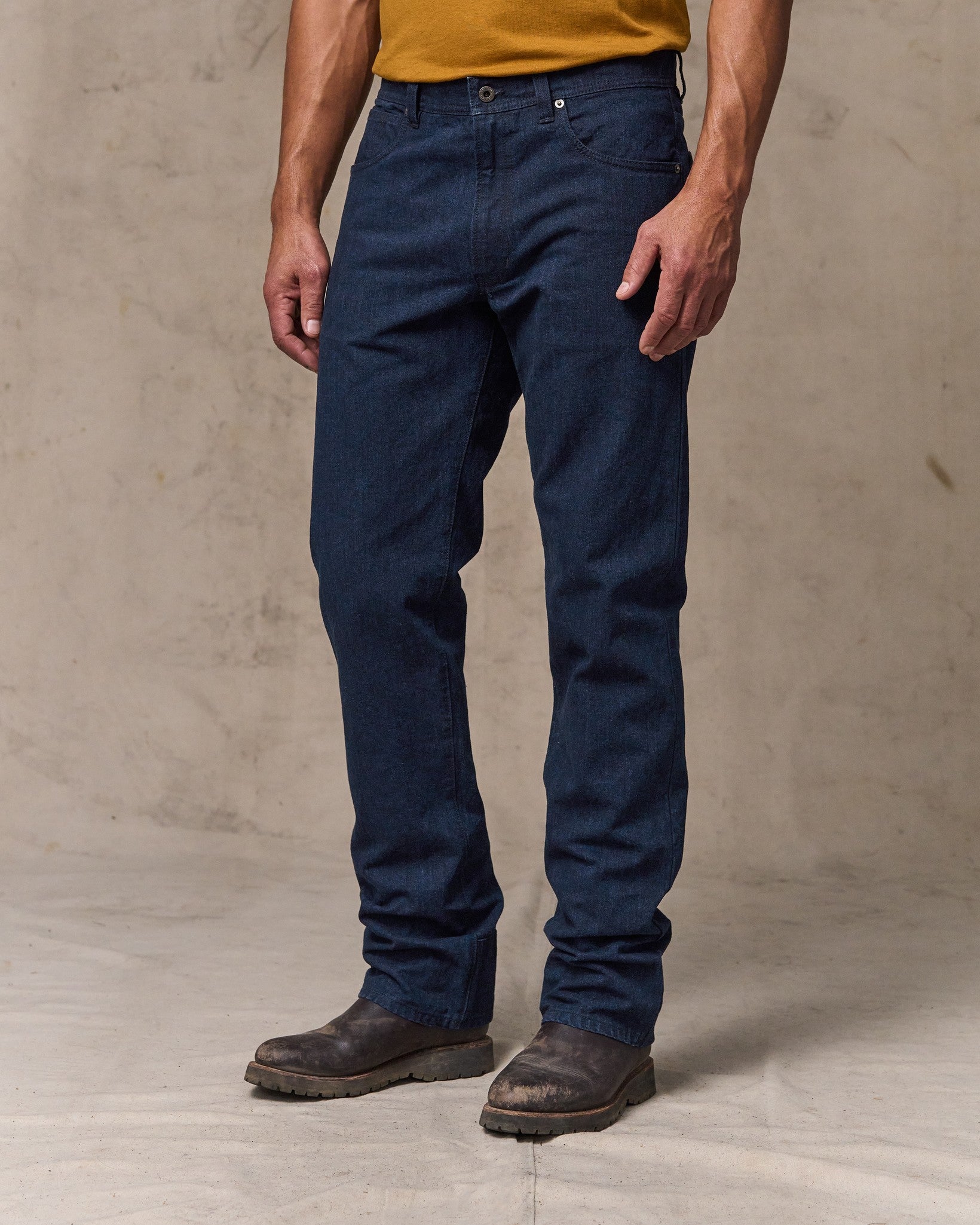 image of a model wearing Filson's Dry Tin Cloth 5-pocket Pants - Indigo