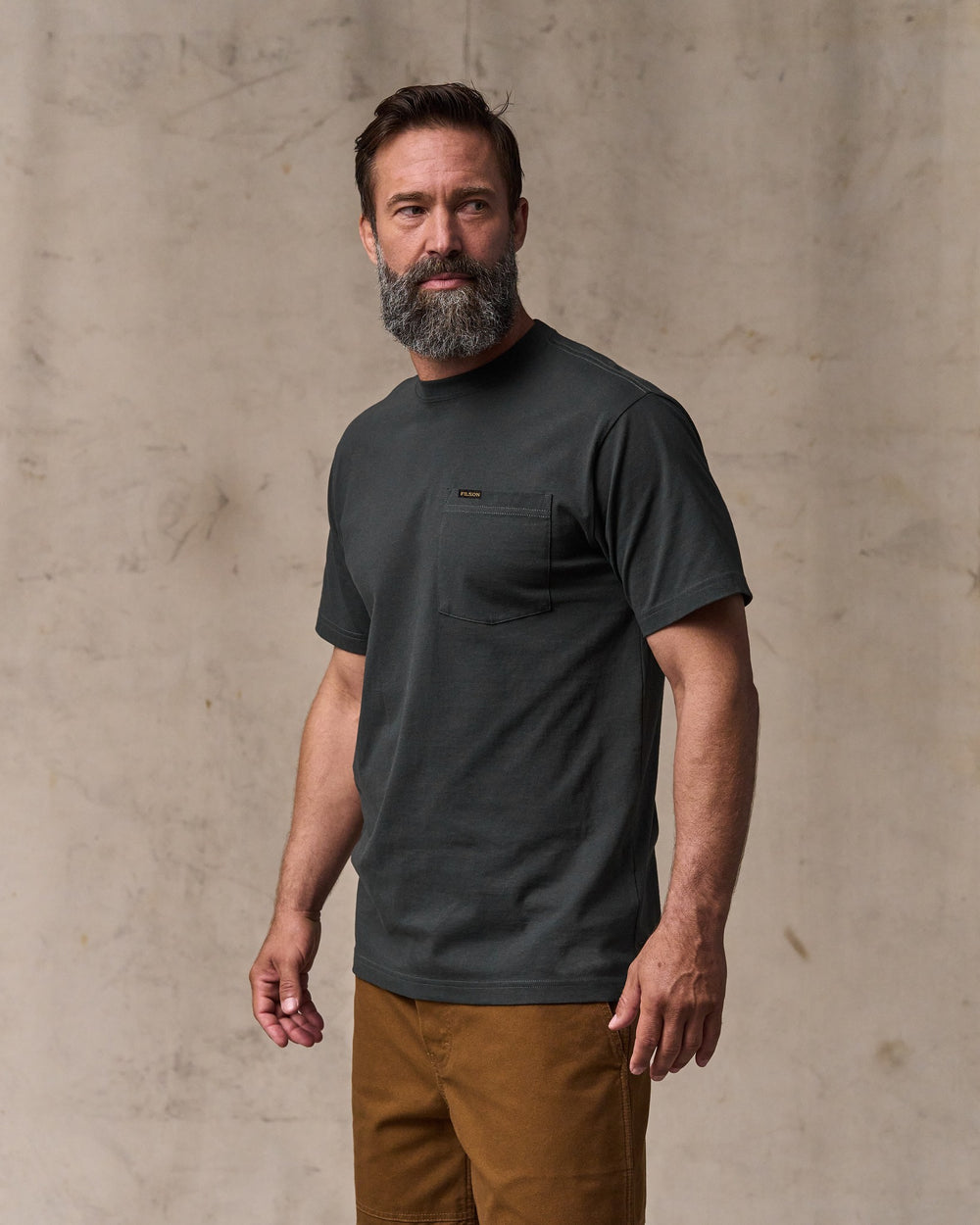 image of a model wearing Filson's Outfitter Pocket T-shirt - Faded Black