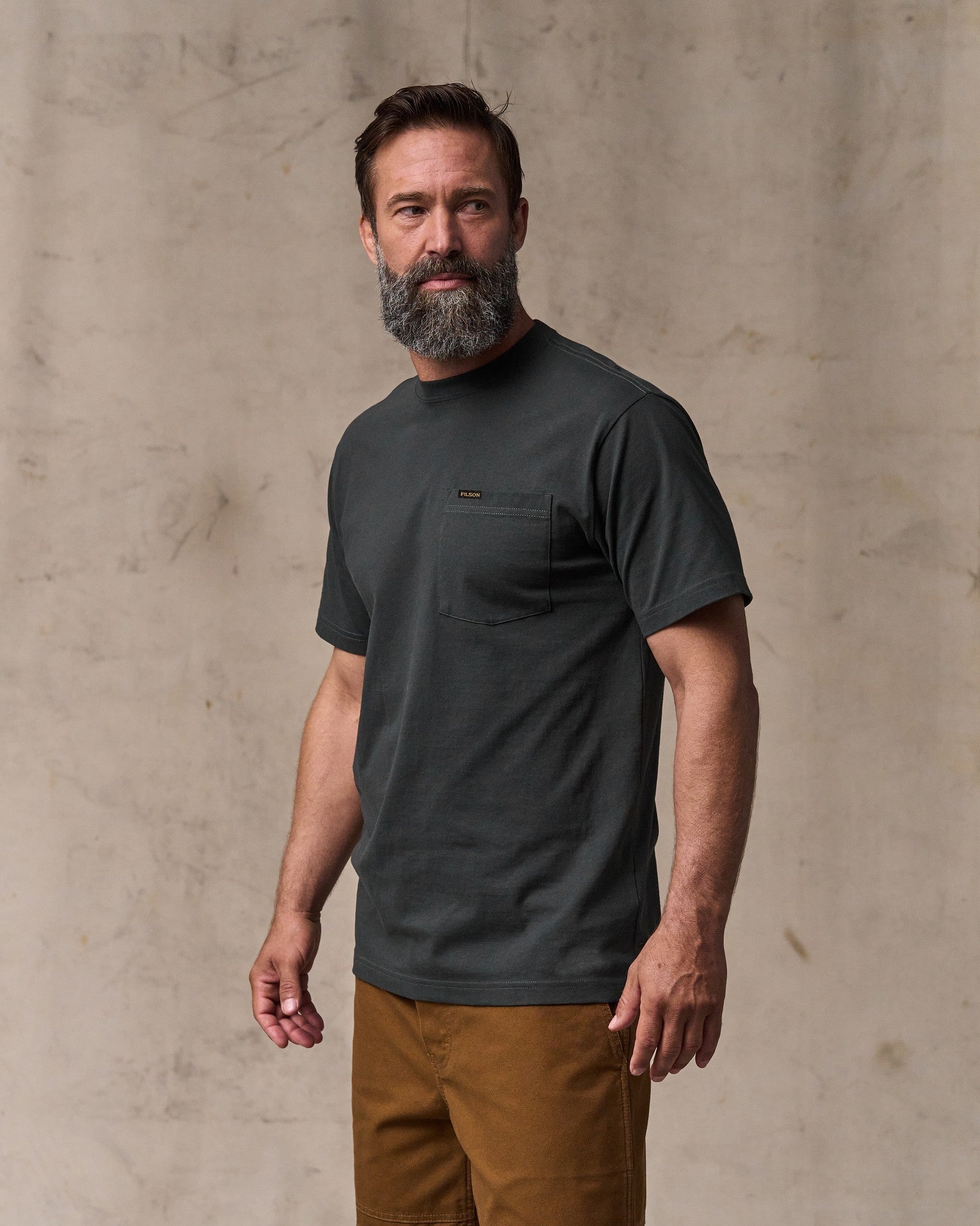 image of a model wearing Filson's Outfitter Pocket T-shirt - Faded Black