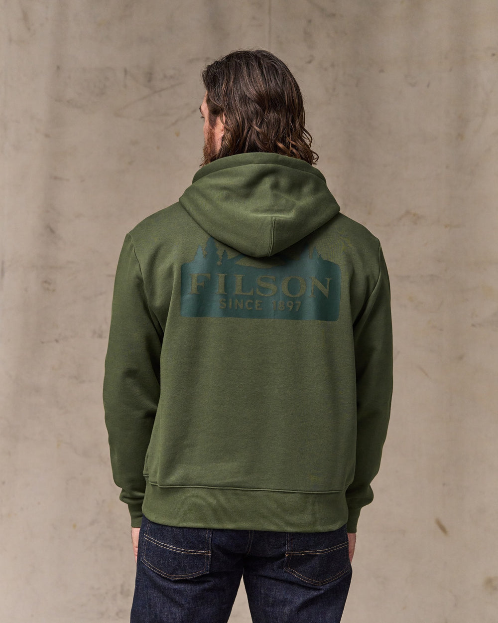 image of a model wearing Filson's Scenic Graphic Hoodie - Surplus Green