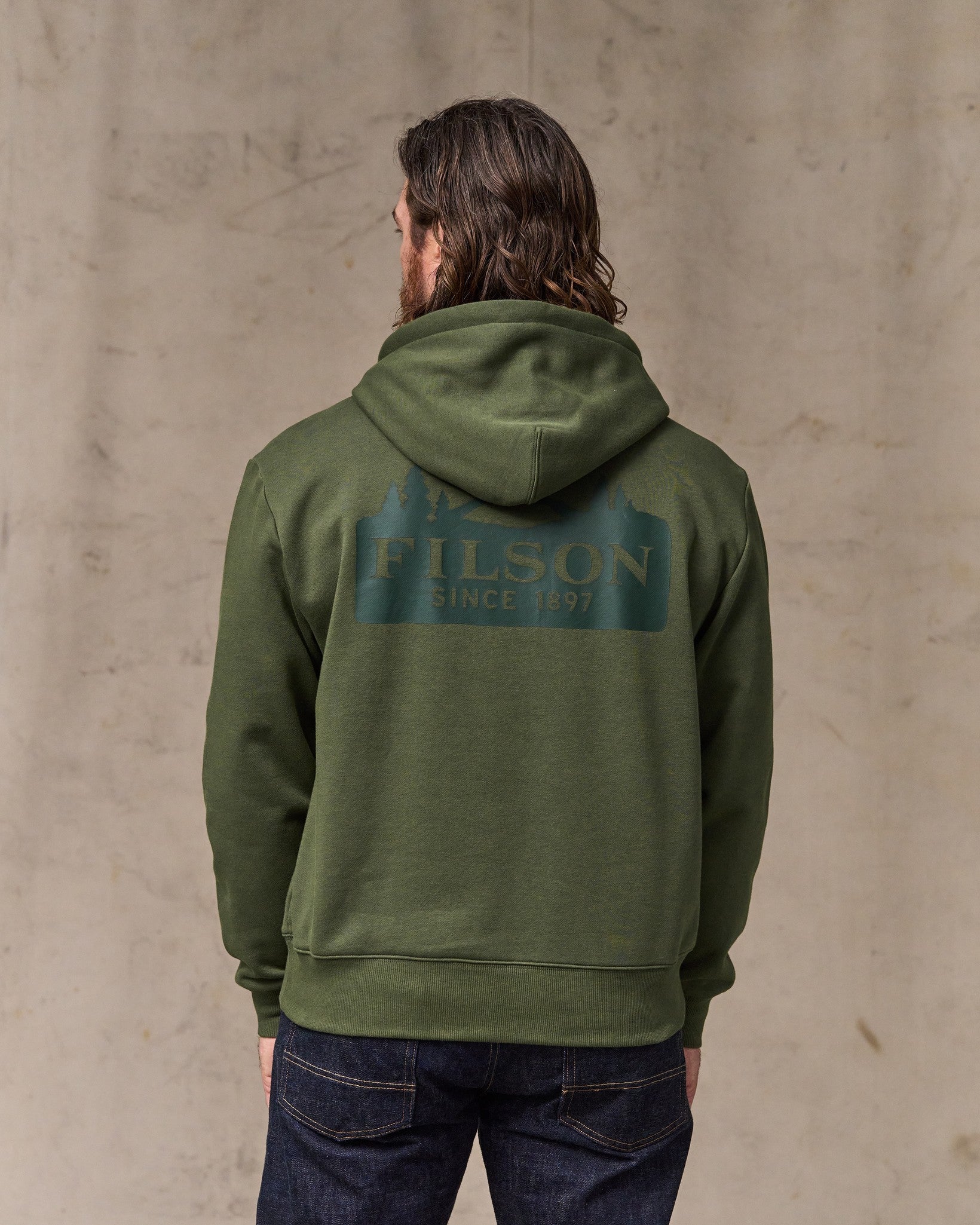 image of a model wearing Filson's Scenic Graphic Hoodie - Surplus Green