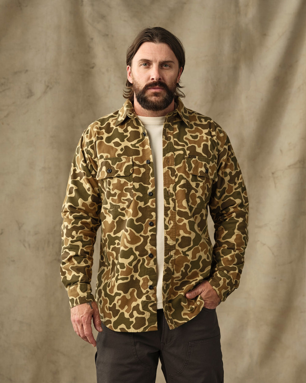 image of a model wearing Filson's Field Flannel Shirt - Buckskin Camo
