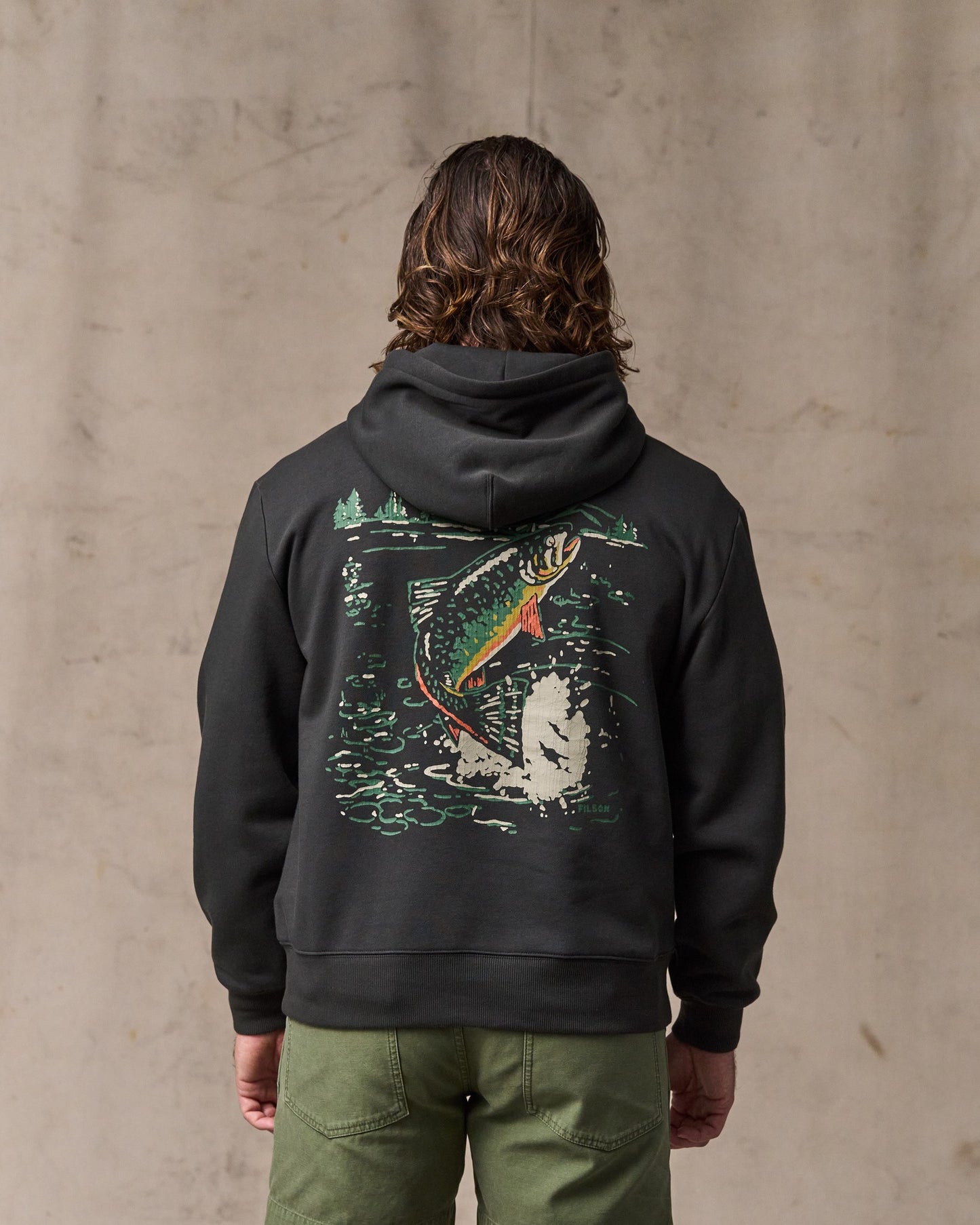 image of a model wearing Filson's Trout Graphic Hoodie - Faded Black
