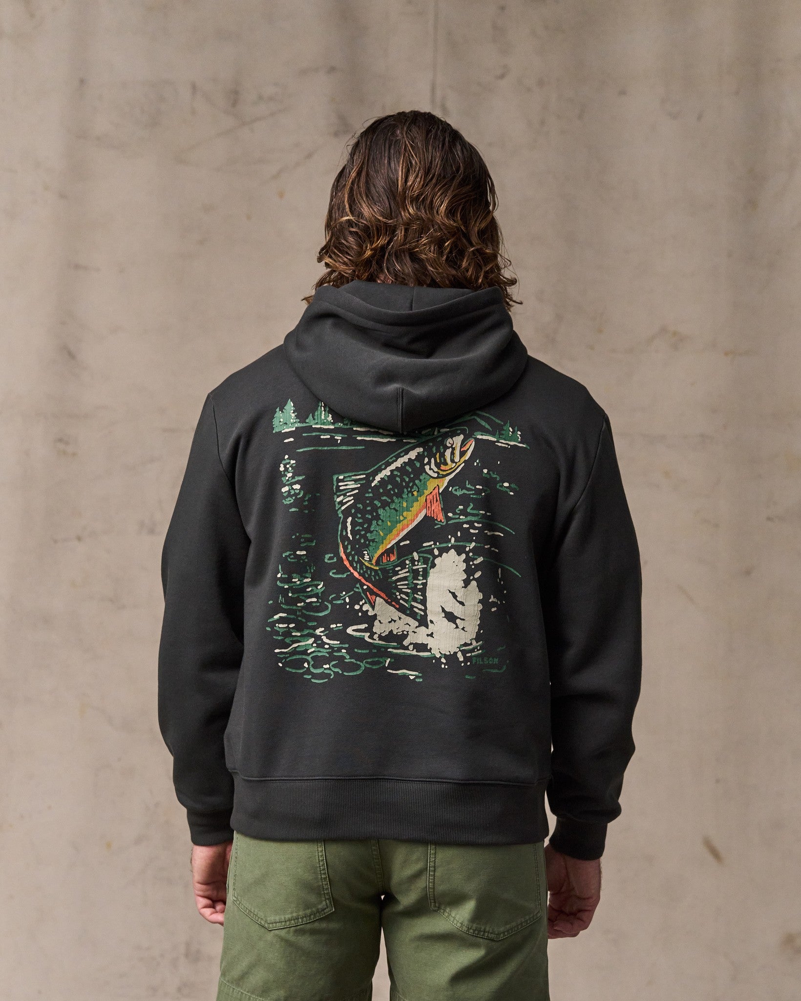image of a model wearing Filson's Trout Graphic Hoodie - Faded Black