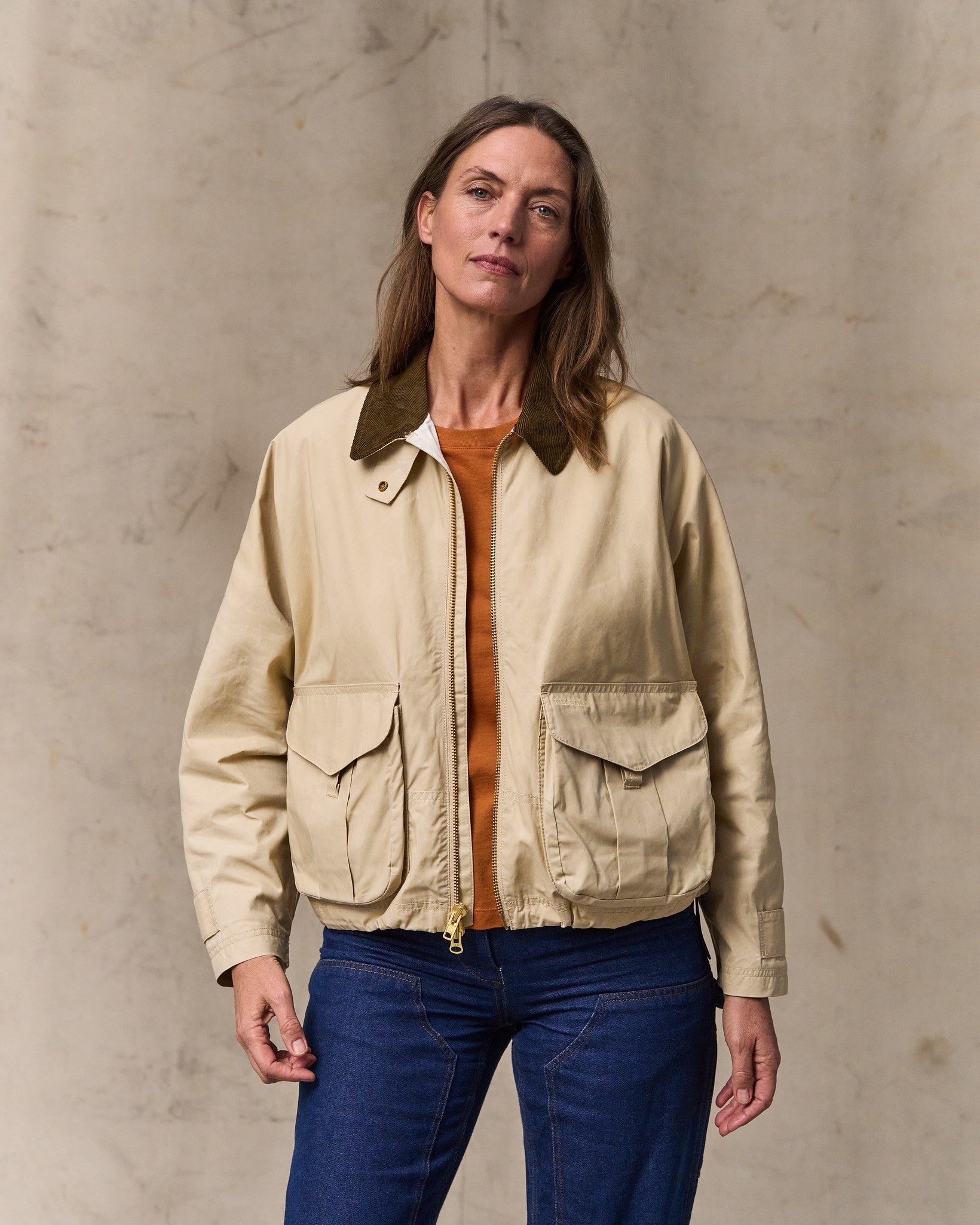 image of a model wearing Filson's Women's Dry Wax Short Work Jacket - Quail Tan