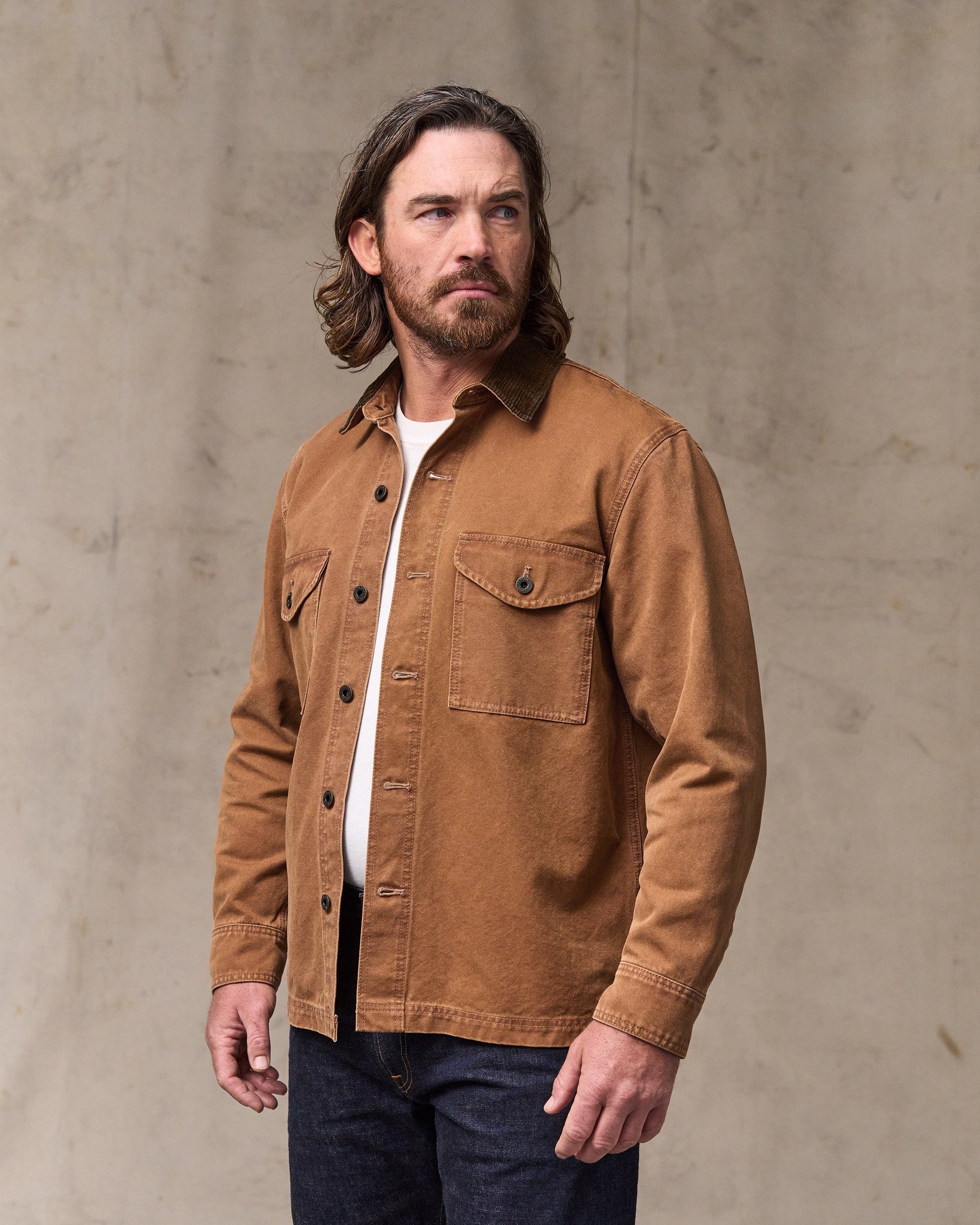 image of a model wearing Filson's Rustic Canvas Jac-shirt - Whiskey