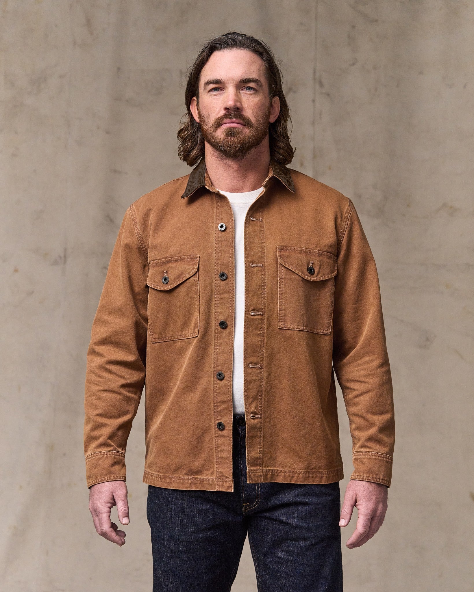 image of a model wearing Filson's Rustic Canvas Jac-shirt - Whiskey