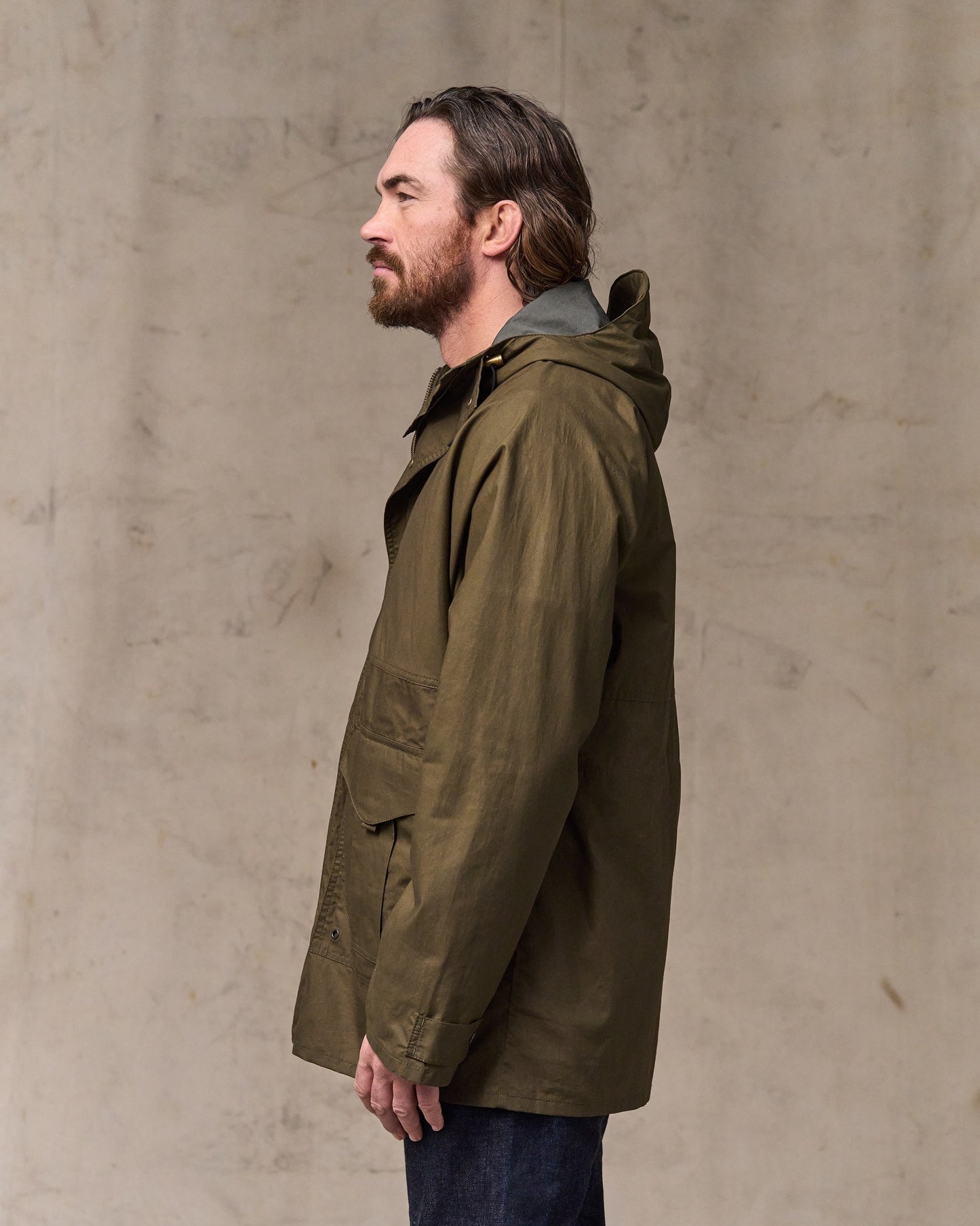 image of a model wearing Filson's Dry Wax Omak Coat - Burnt Olive