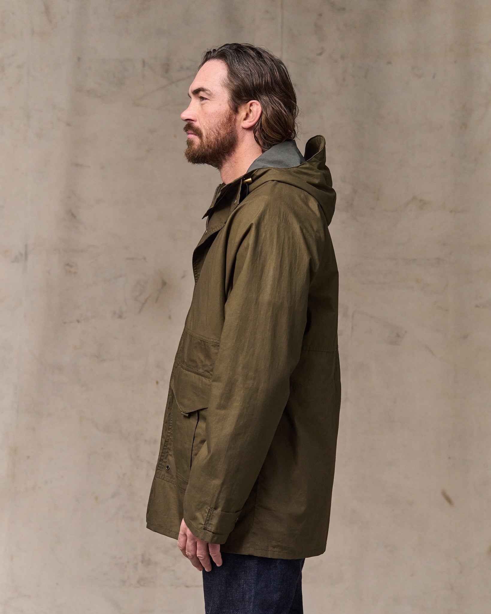 image of a model wearing Filson's Dry Wax Omak Coat - Burnt Olive