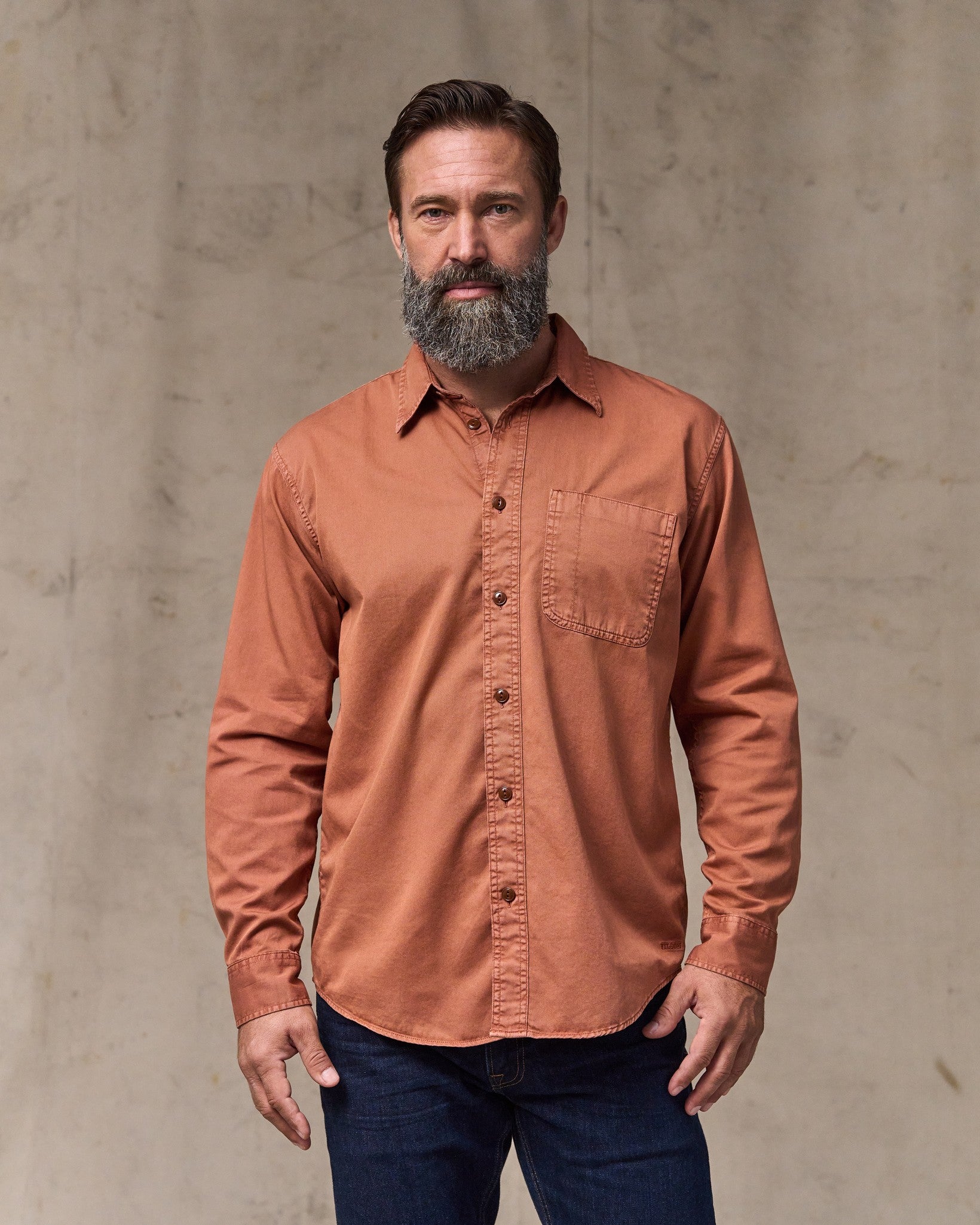 image of a model wearing Filson's 4.5-oz. Twill Shirt - Copper Brown