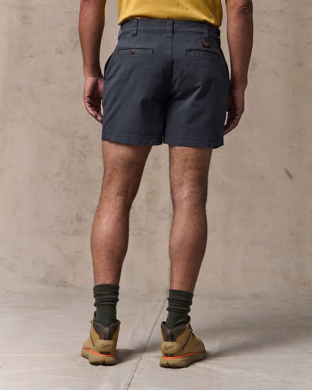image of a model wearing Filson's Granite Mountain 6" Shorts - Ink Blue
