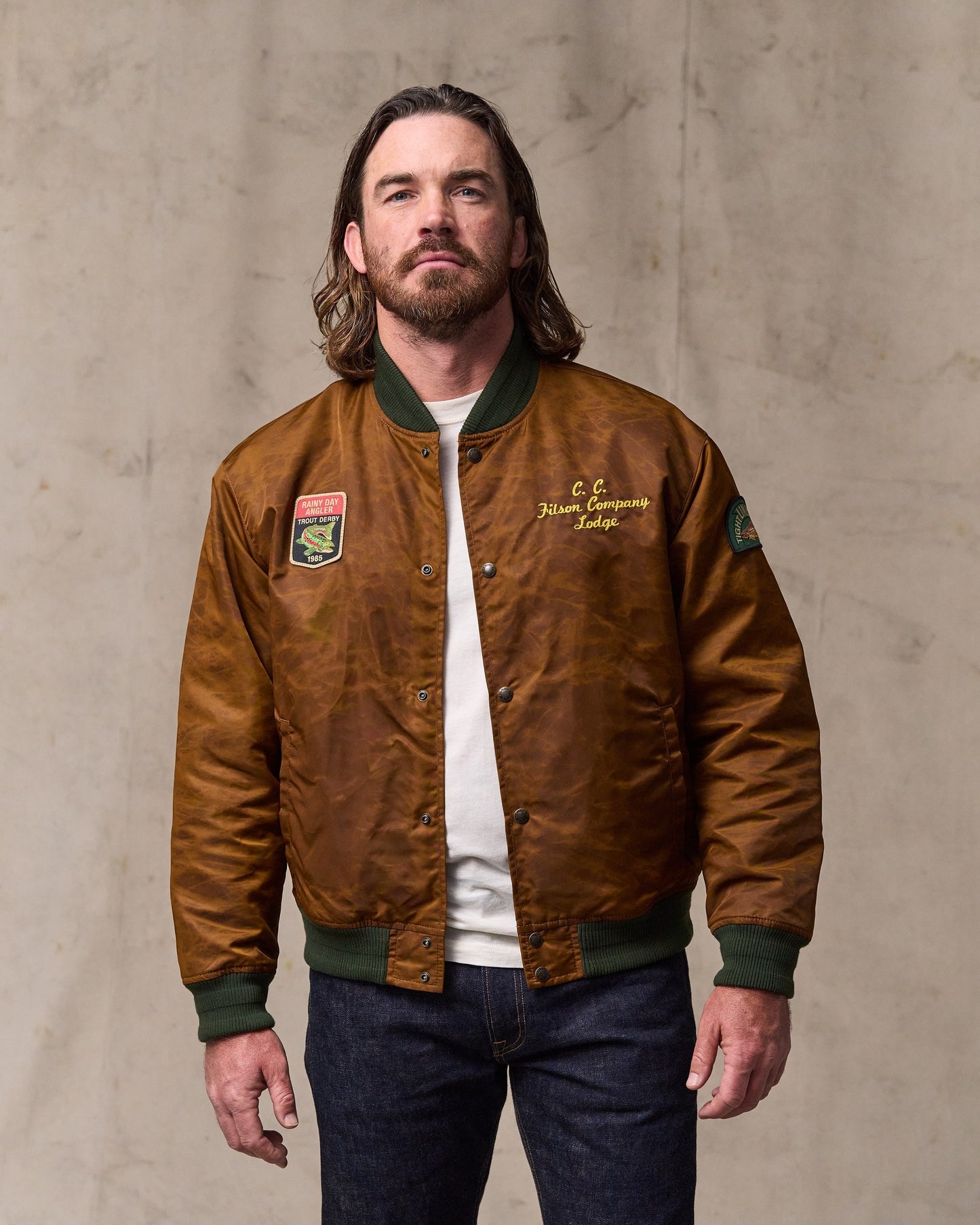 image of a model wearing Filson's Embroidered Montlake Jacket - Whiskey|Model is 6'1" wearing a size medium