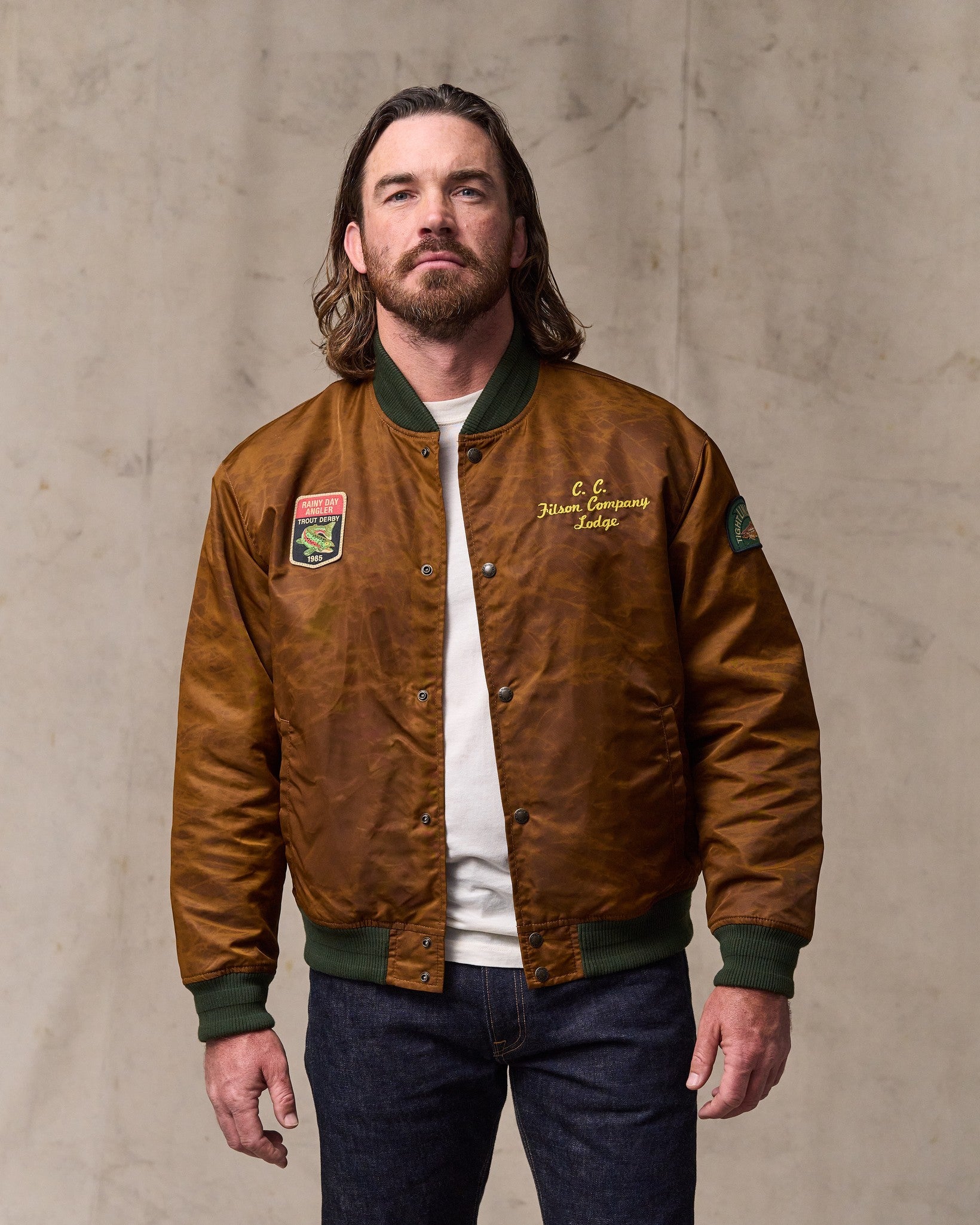 image of a model wearing Filson's Embroidered Montlake Jacket - Whiskey