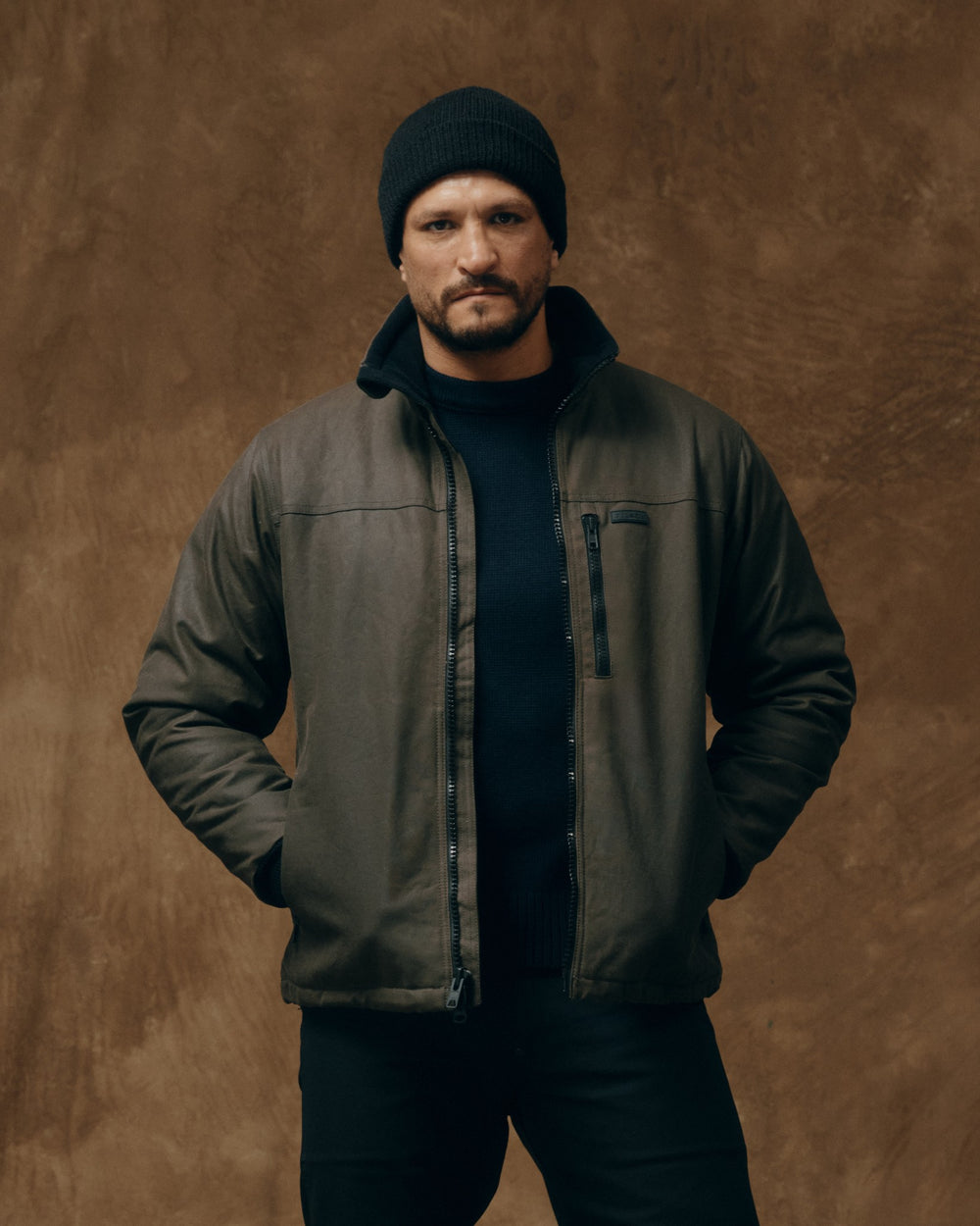 image of a model wearing Filson's Tin Cloth Primaloft Jacket - Otter Green