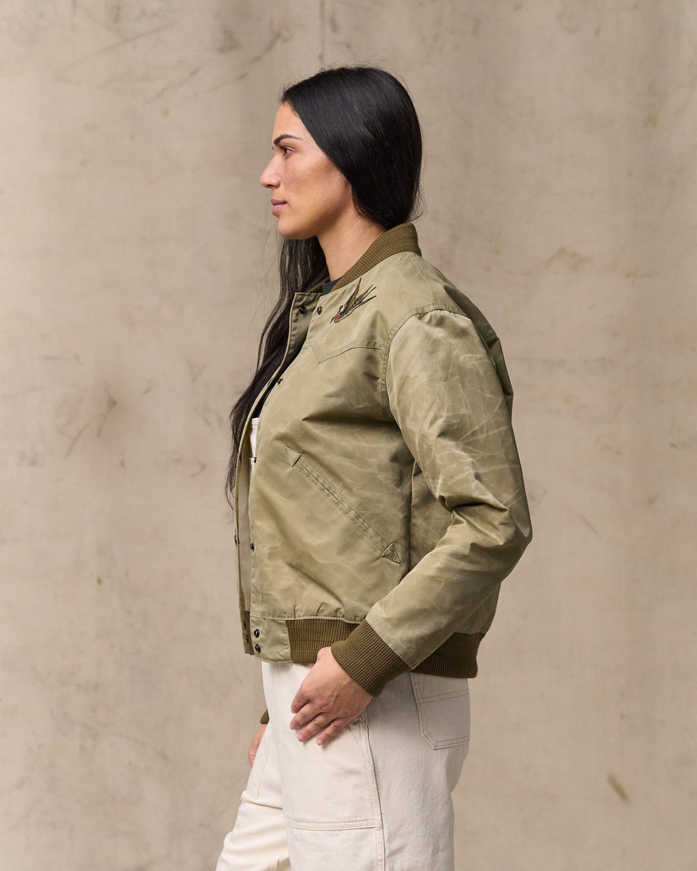 image of a model wearing Filson's Women's Western Satin Jacket - Silver Sage