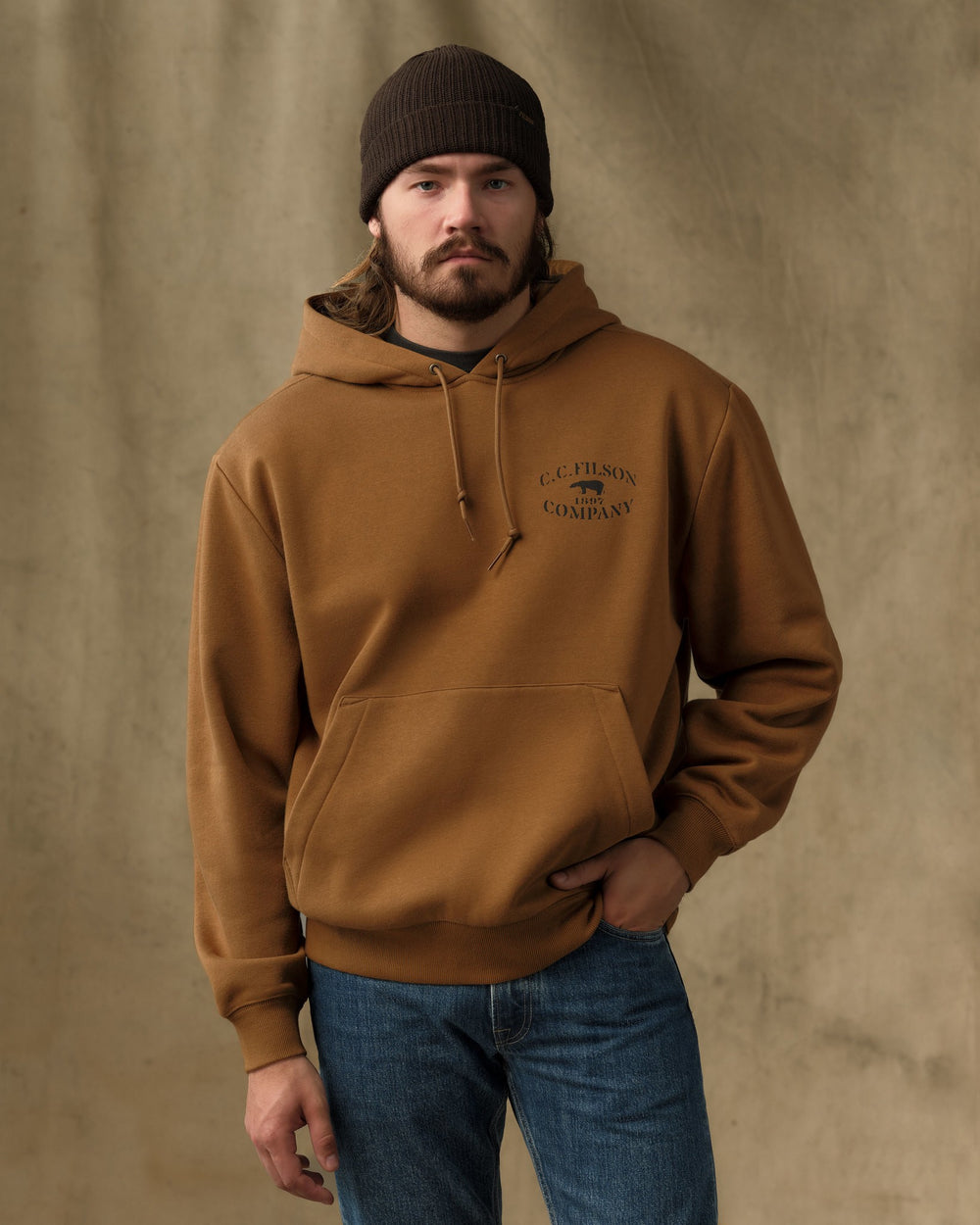 image of a model wearing Filson's Stencil Graphic Hoodie - Whiskey