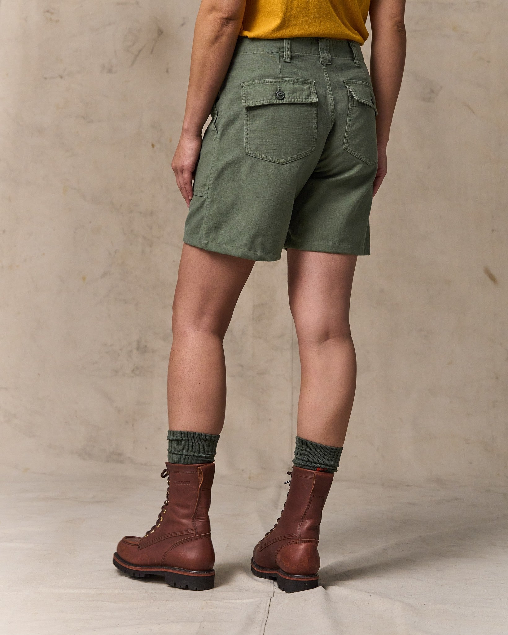 image of a model wearing Filson's Women's Reverse Sateen Supply Shorts - Service Green