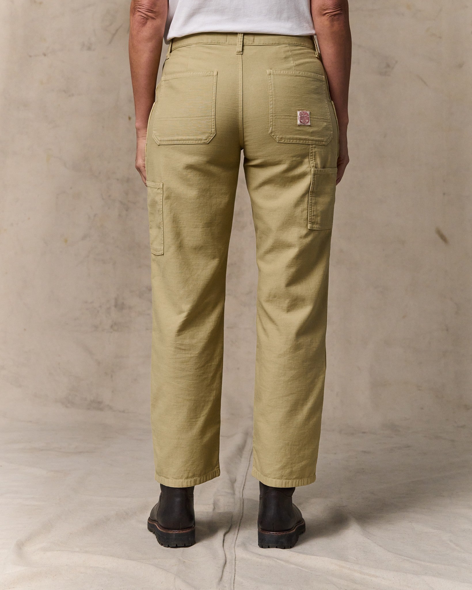 image of a model wearing Filson's Women's Reverse Sateen Double Front Pants - Antique Khaki