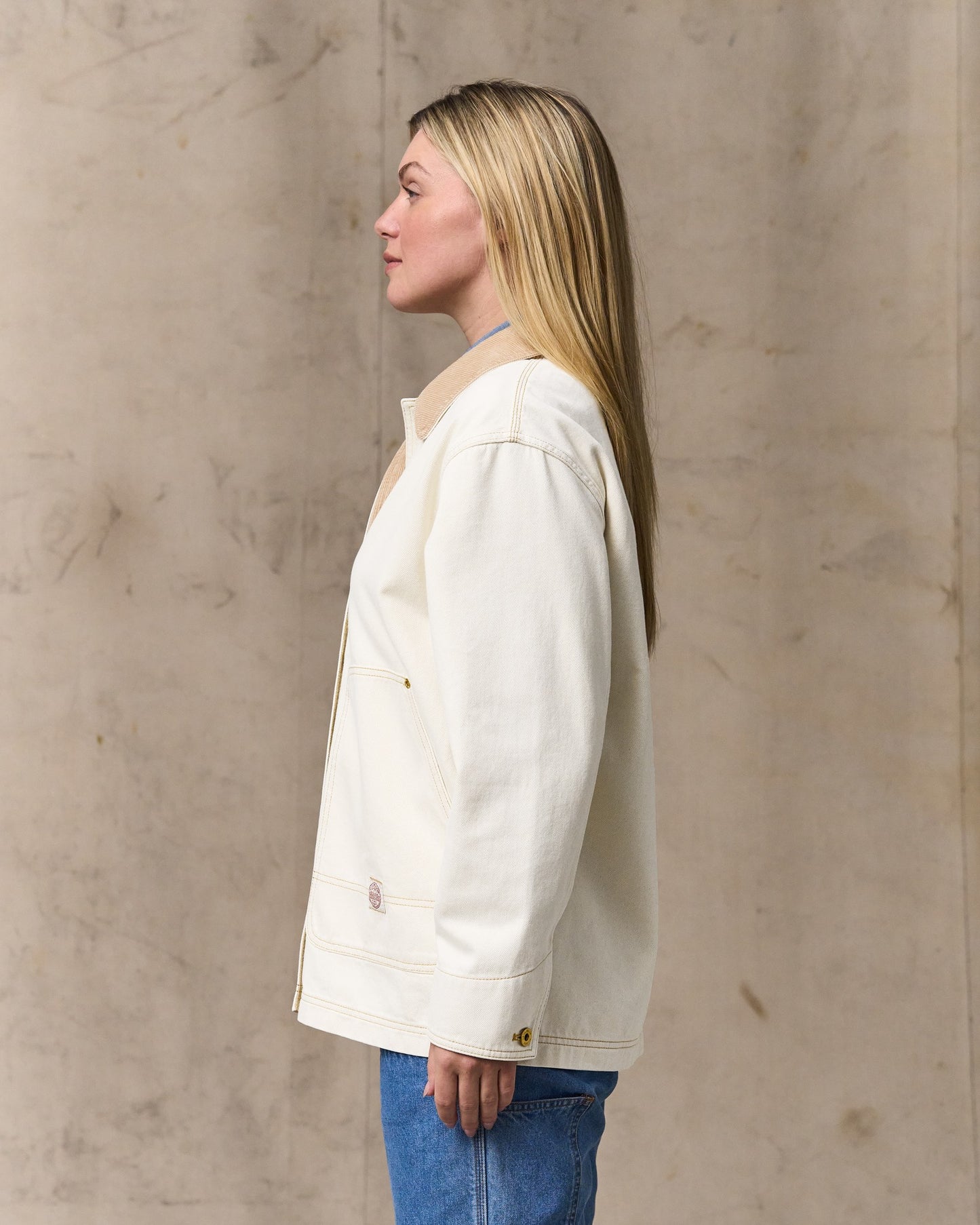 image of a model wearing Filson's Women's 11-oz. Denim Barn Coat - Natural Seed