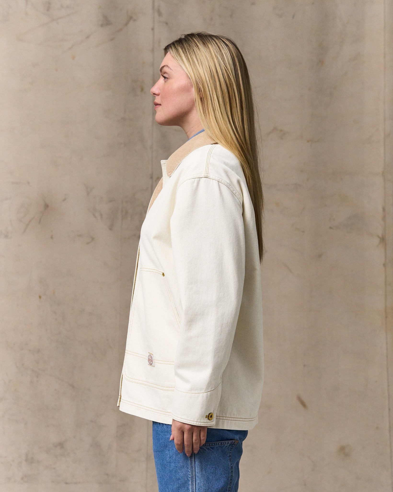 image of a model wearing Filson's Women's 11-oz. Denim Barn Coat - Natural Seed