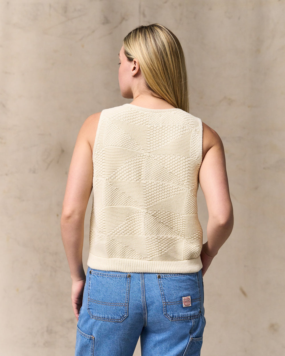 image of a model wearing Filson's Women's Cotton Sweater Vest - Ivory