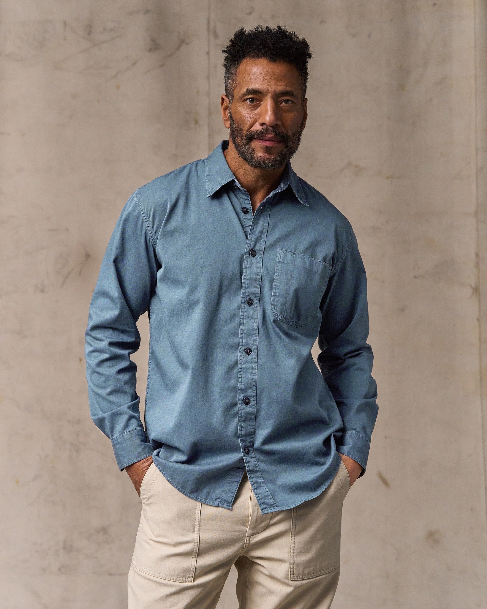 image of a model wearing Filson's 4.5-oz. Twill Shirt - Orion Blue