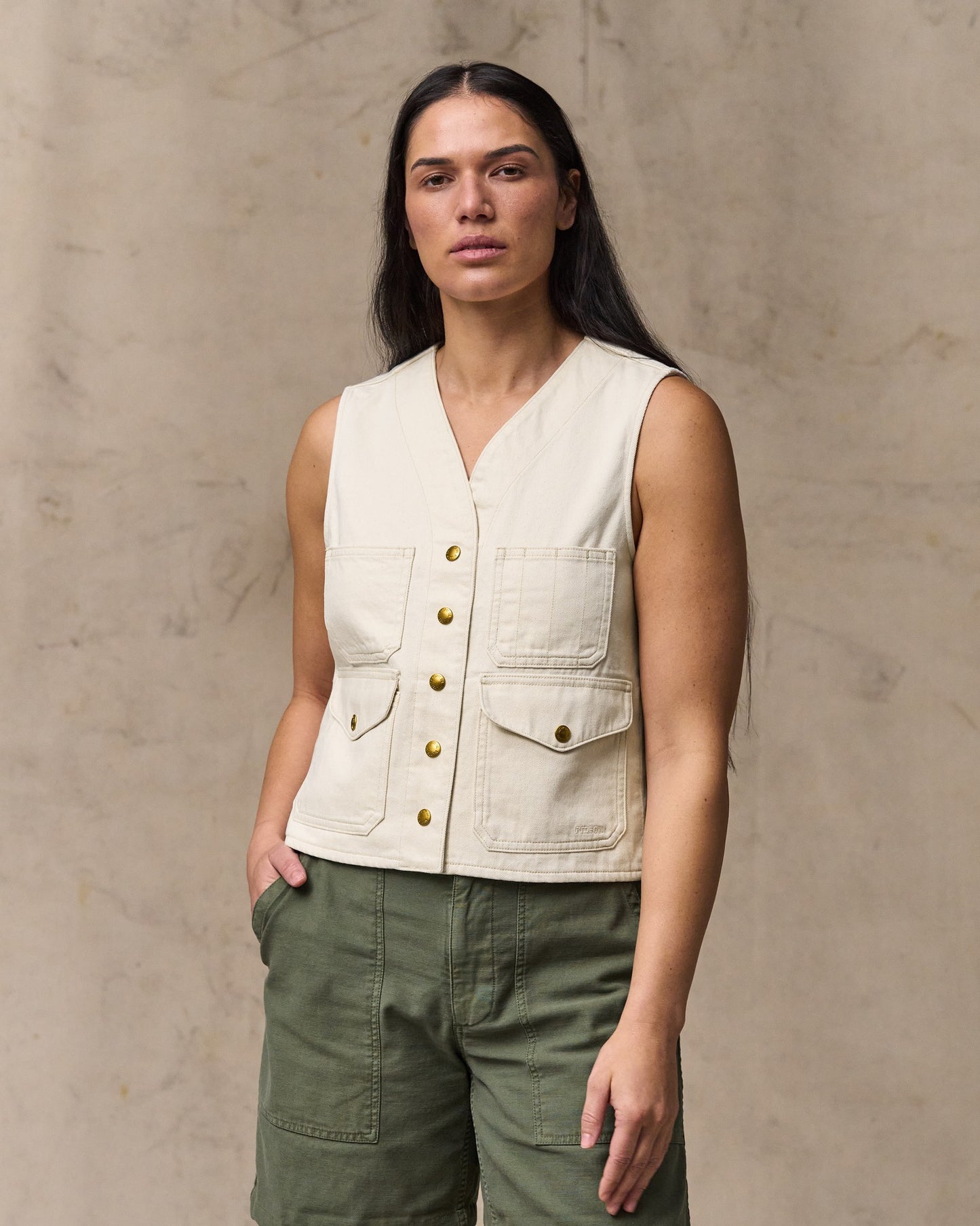 image of a model wearing Filson's Women's Archive Cruiser Vest - Natural Seed|Model is 5'10" wearing a size medium|Model is 5'10" wearing a size medium