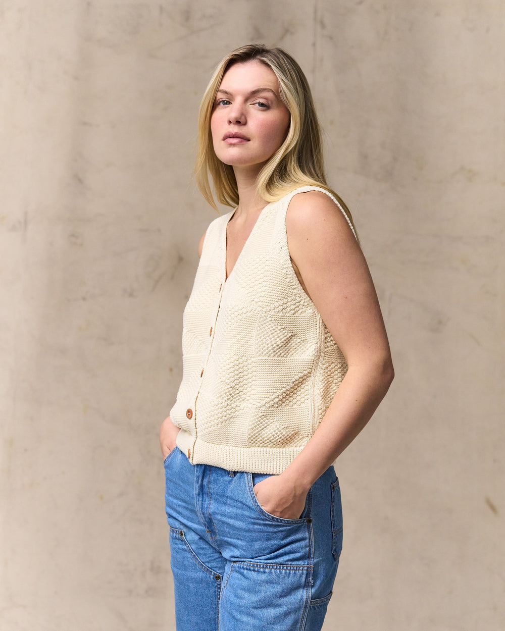 image of a model wearing Filson's Women's Cotton Sweater Vest - Ivory