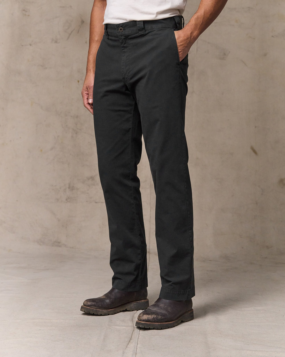 image of a model wearing Filson's Granite Mountain Flat Front Pants - Washed Faded Black