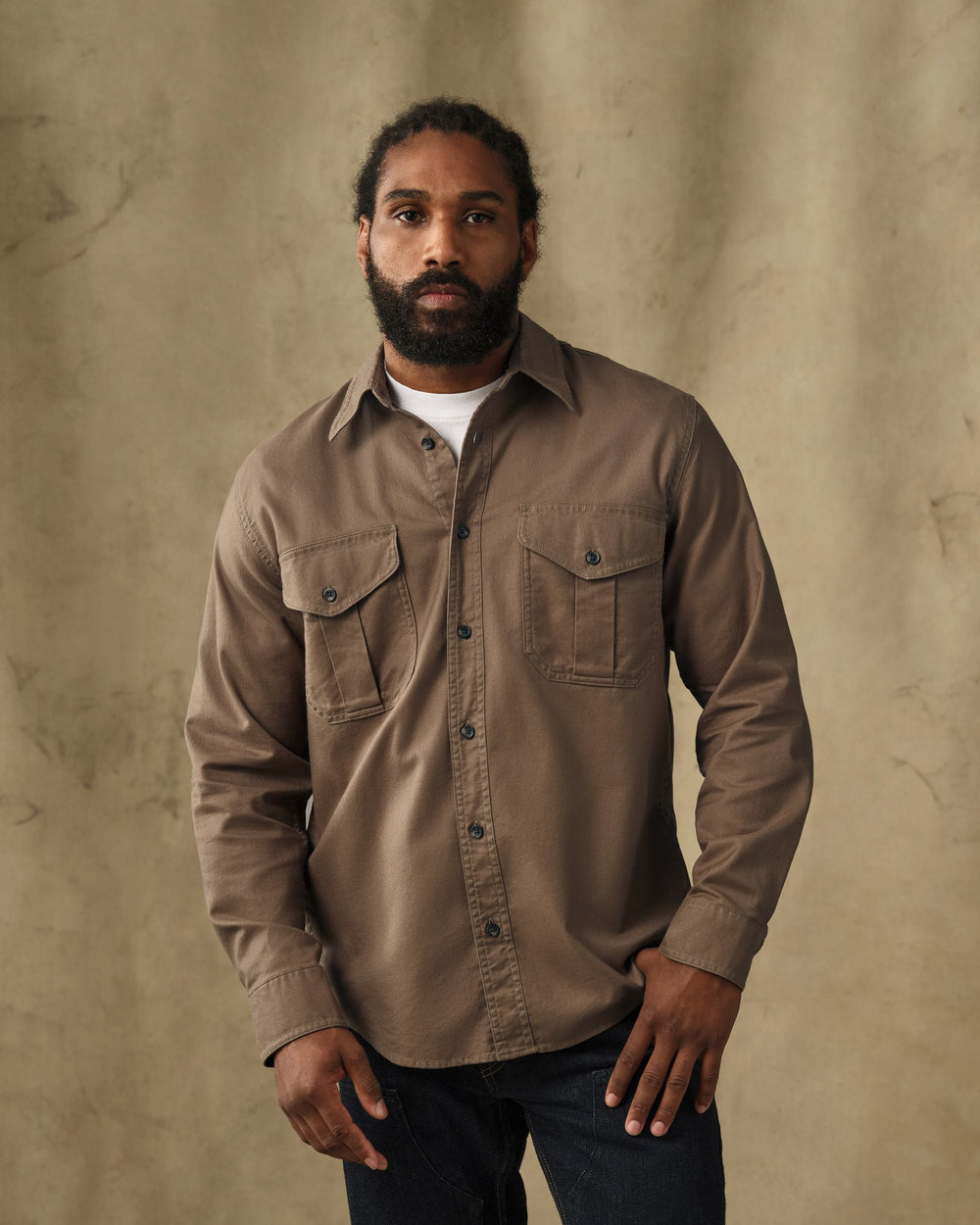 image of a model wearing Filson's Lightweight Alaskan Guide Shirt - Teak