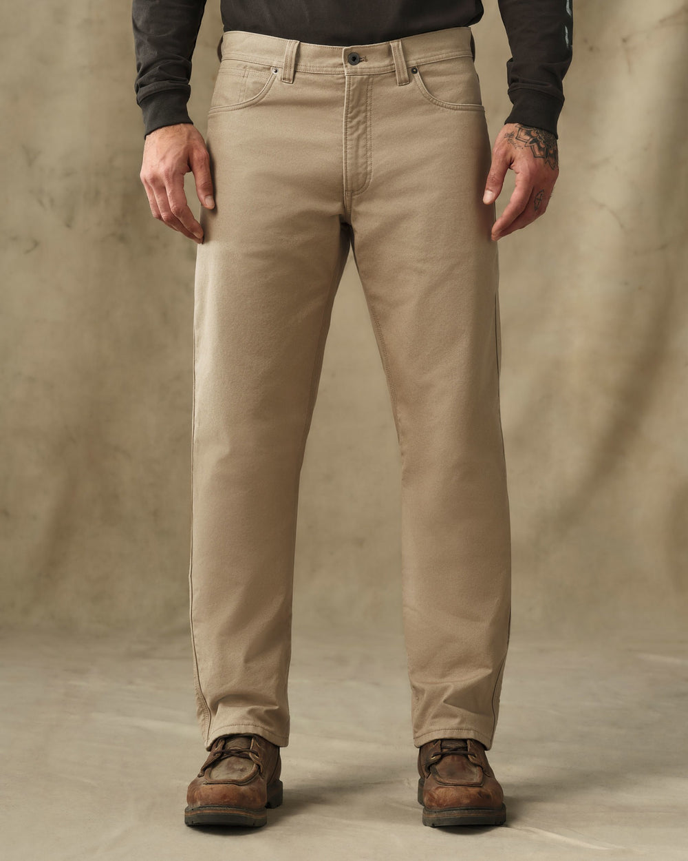 image of a model wearing Filson's Lined Dry Tin Pants - Khaki