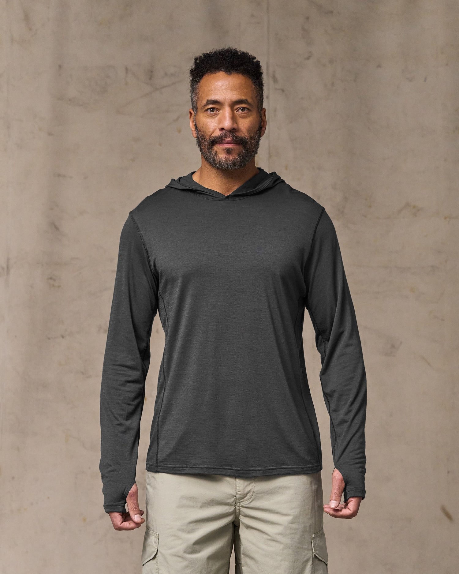 image of a model wearing Filson's Wool-blend Upf Hoodie - Raven|Model is 6'2" wearing a size medium