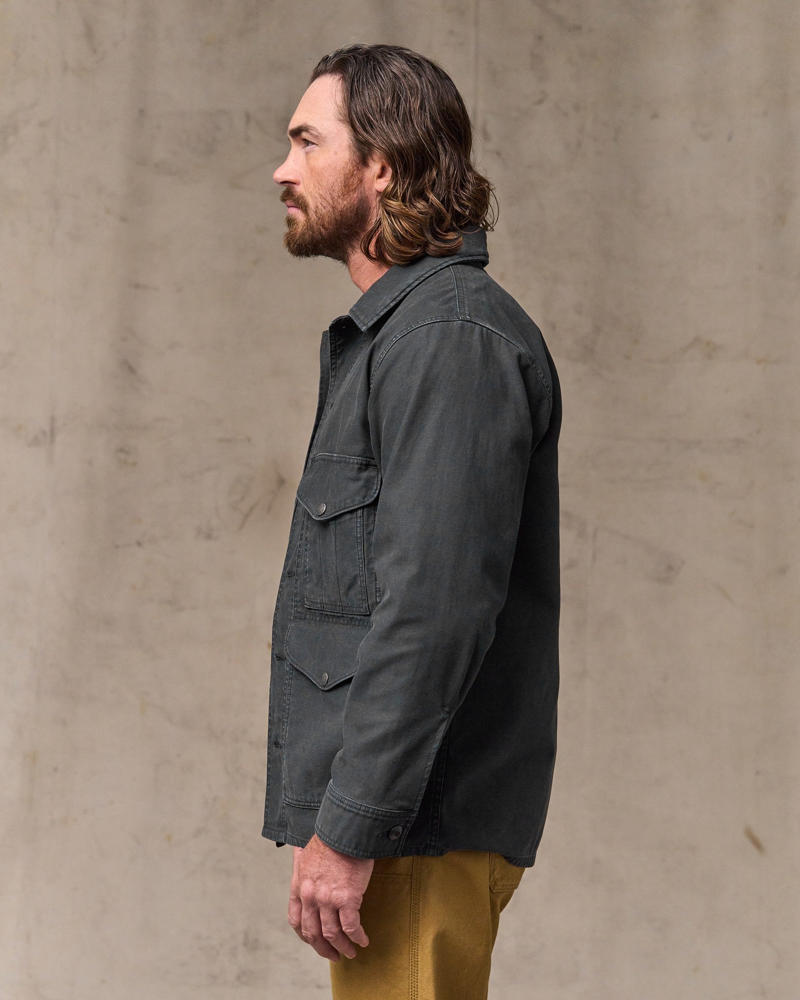 image of a model wearing Filson's Field Cruiser Jacket - Washed Faded Black
