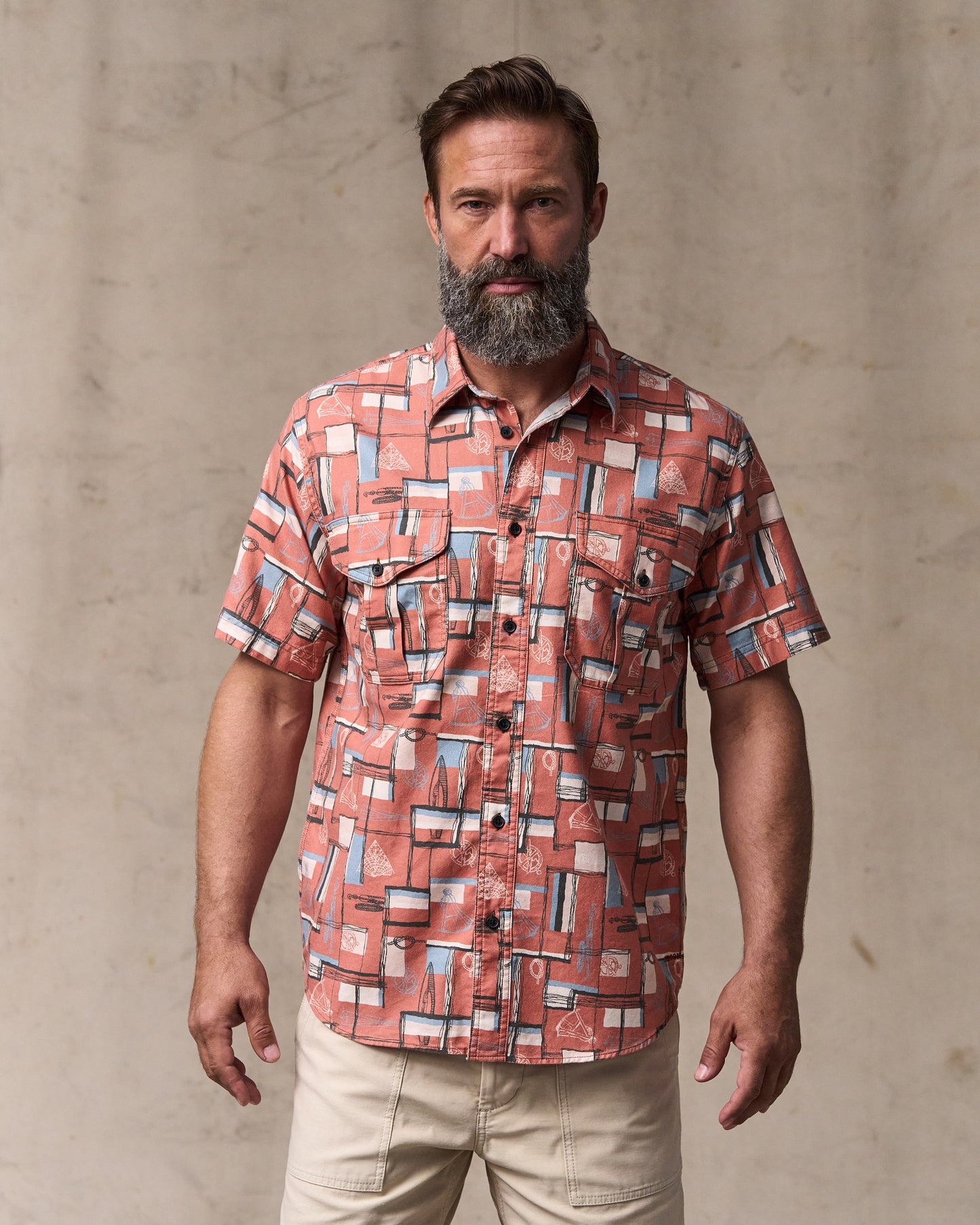 image of a model wearing Filson's Short Sleeve Lightweight Alaskan Guide Shirt  - Russet / Print|Model is 6'1" wearing a size medium