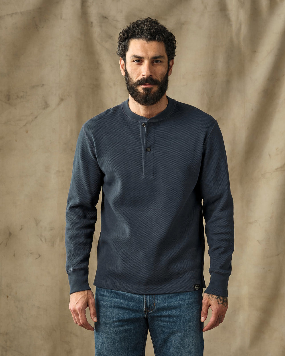 image of a model wearing Filson's Waffle Knit Henley - Blue Mussel
