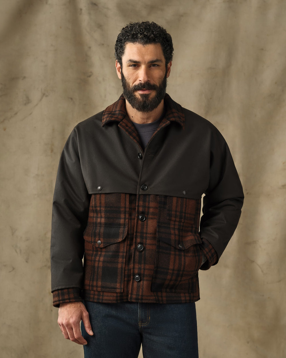 image of a model wearing Filson's Mackinaw Wool Caped Cruiser Jacket - Brick Plaid