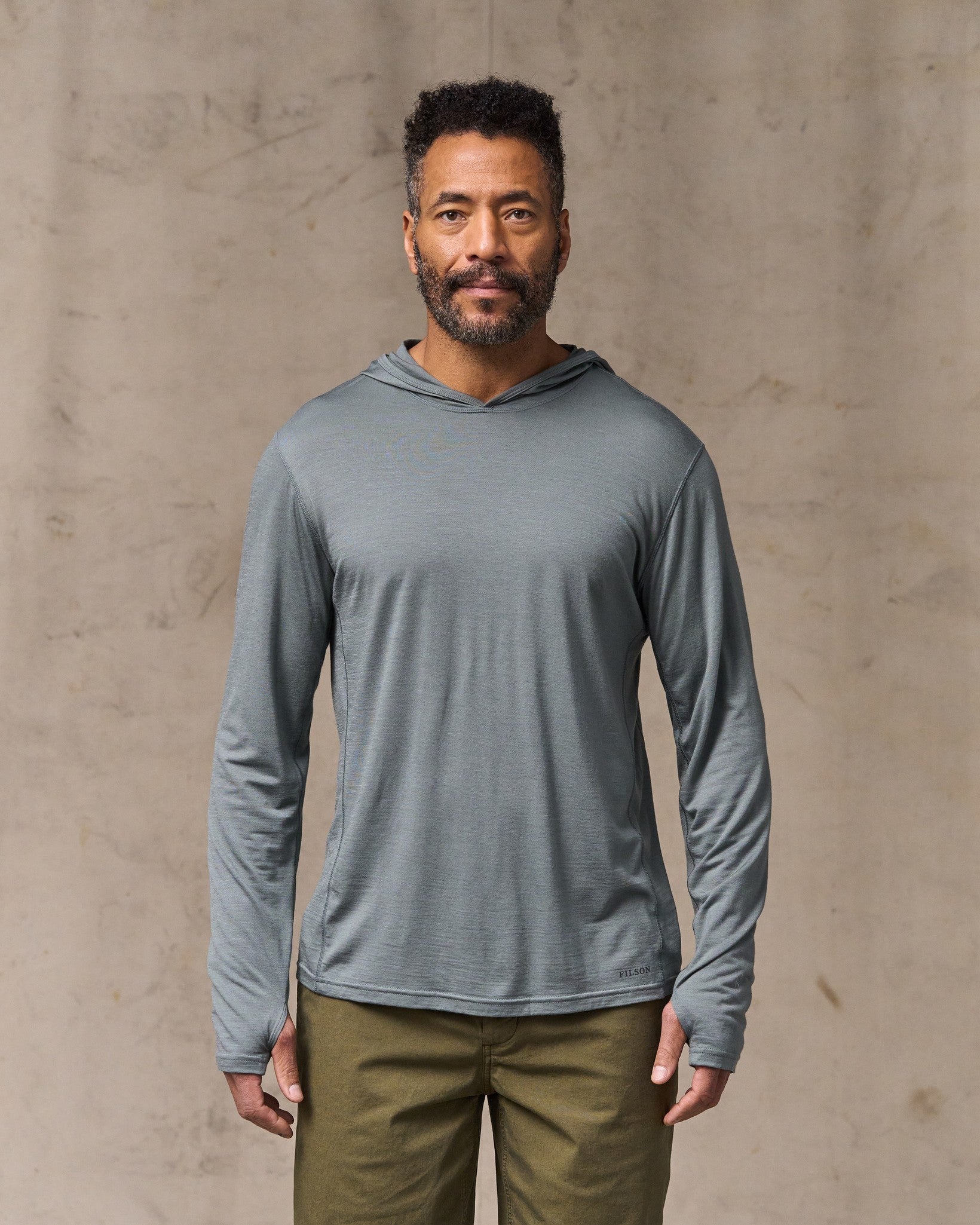 image of a model wearing Filson's Wool-blend Upf Hoodie - Sage Gray