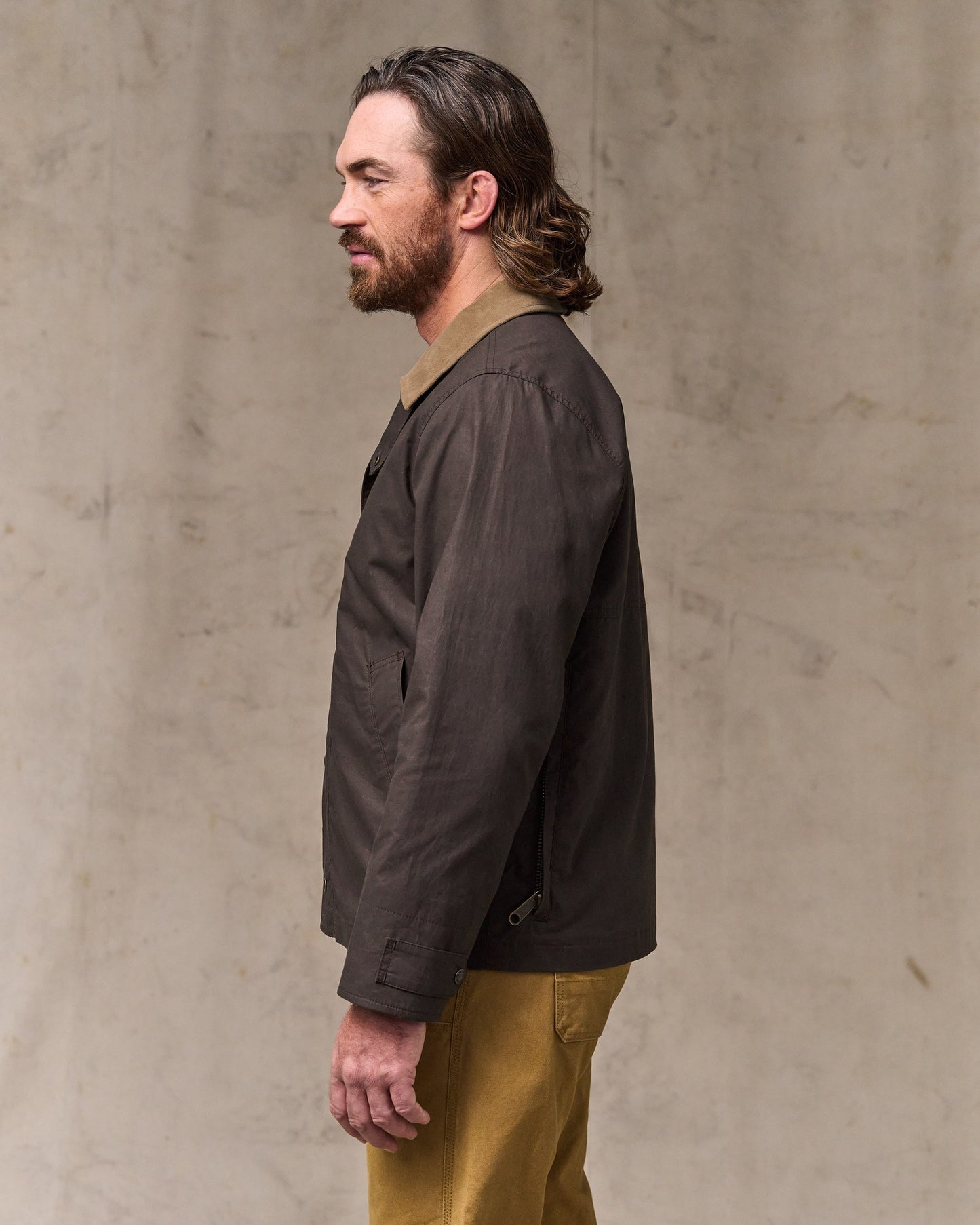 image of a model wearing Filson's Dry Wax Short Field Jacket - Dark Brown