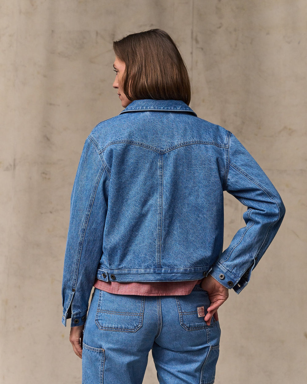 image of a model wearing Filson's Women's Western Denim Jacket - Light Indigo