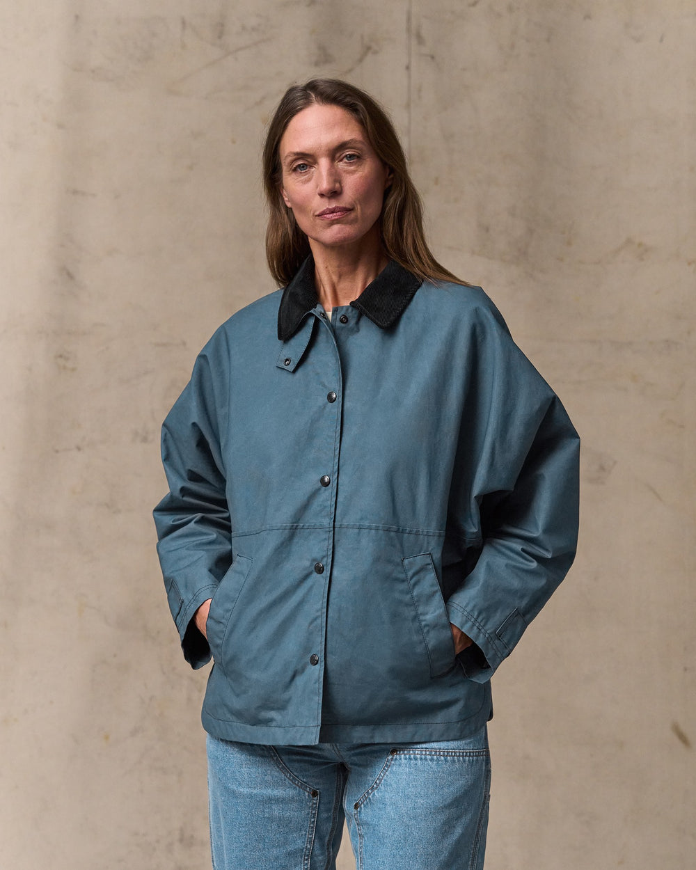 image of a model wearing Filson's Women's Harbor Front Waxed Jacket - Navy